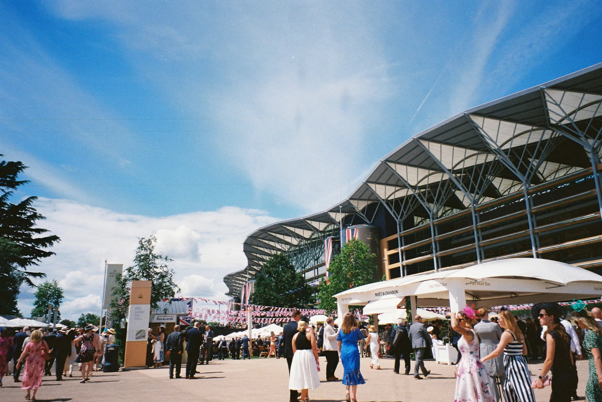 Luxury gifts for men: the grandstand at Ascot racecourse under a blue sky