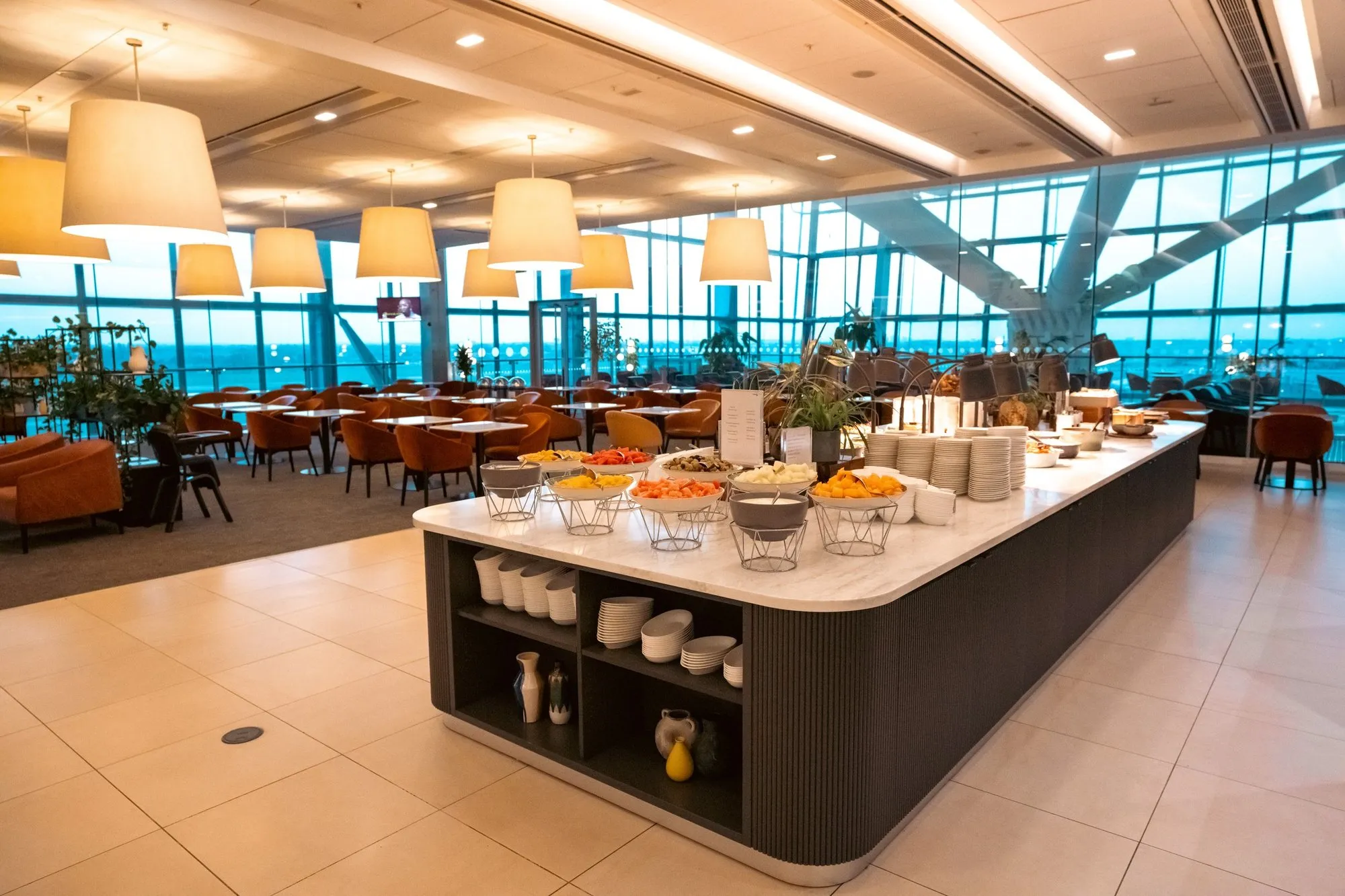 The Galleries North Club lounge at Heathrow Terminal 5, with the buffet and airfield windows