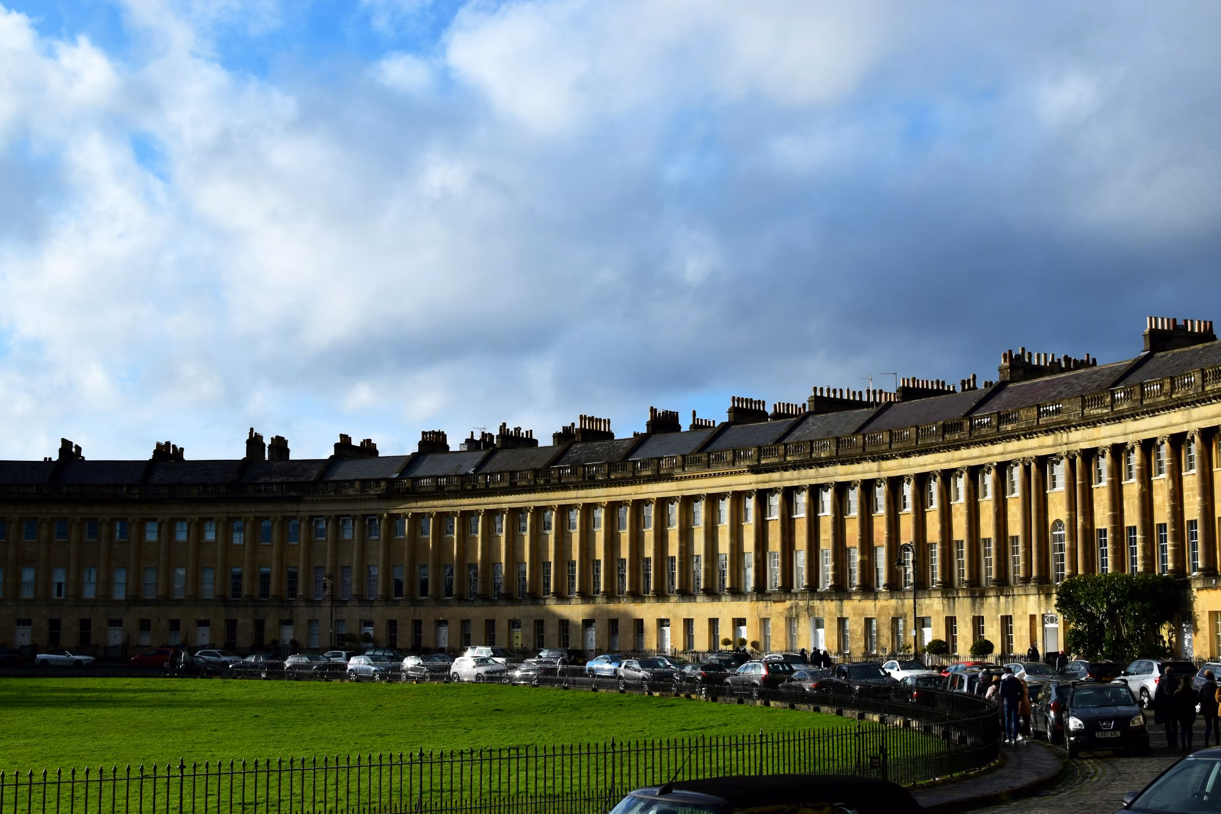 The Royal Crescent lawn in Bath in late afternoon light