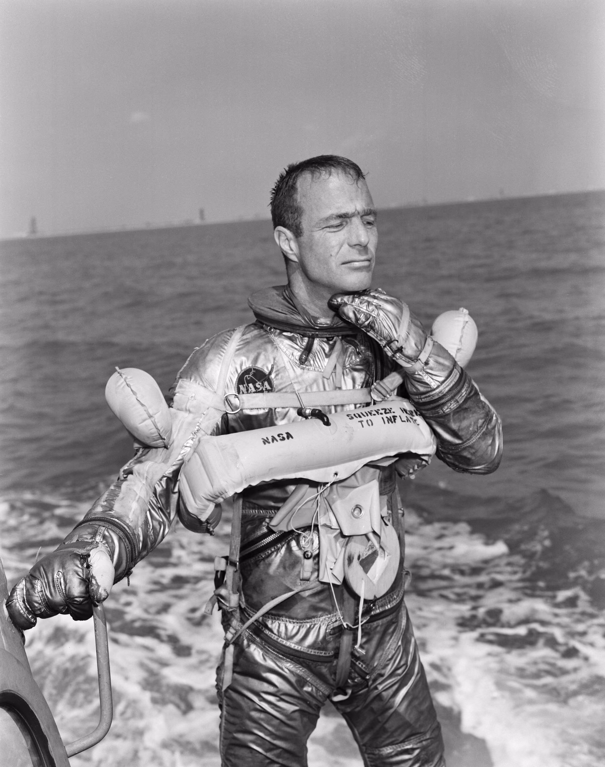 Scott Carpenter in his pressure suit during water egress training for Mercury-Atlas 7, the flight that took the first Swiss wristwatch to space, Breitling says