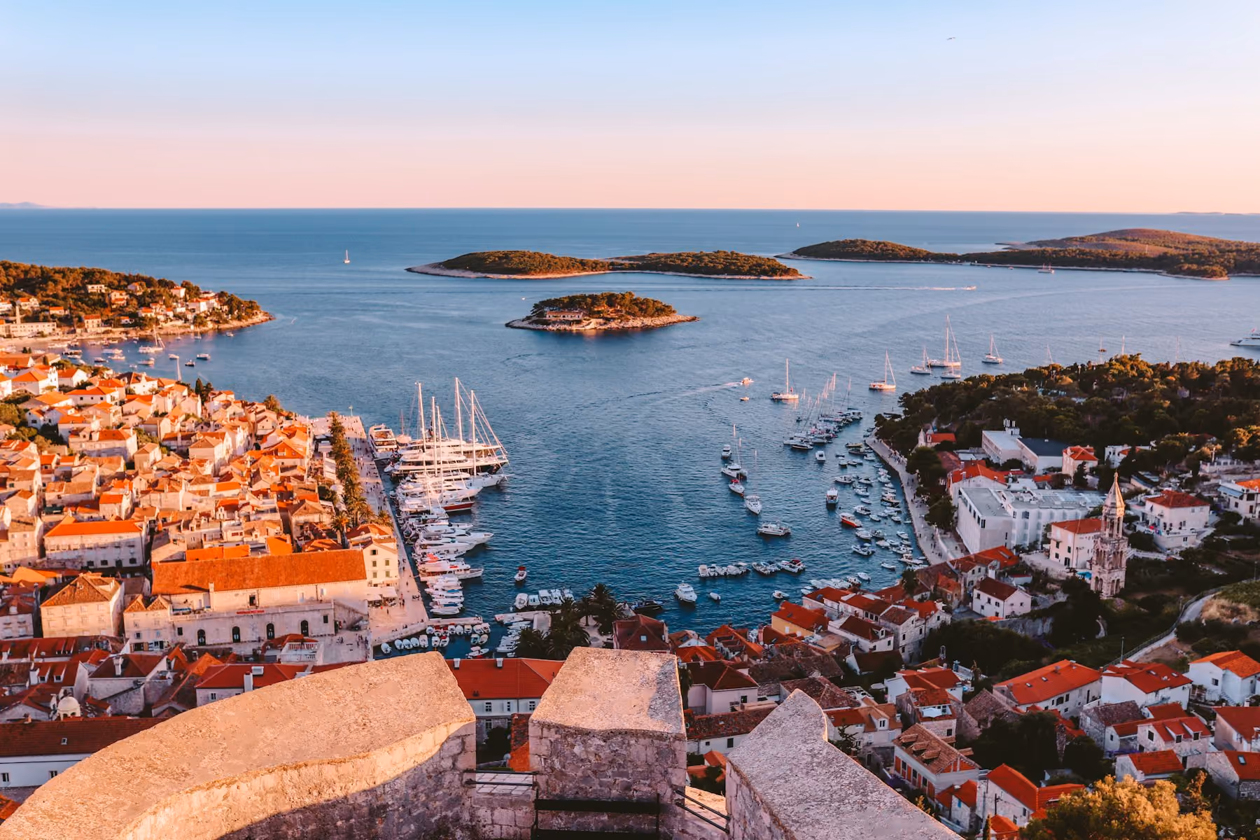 Hvar Town's harbour and the Pakleni islands at dusk
