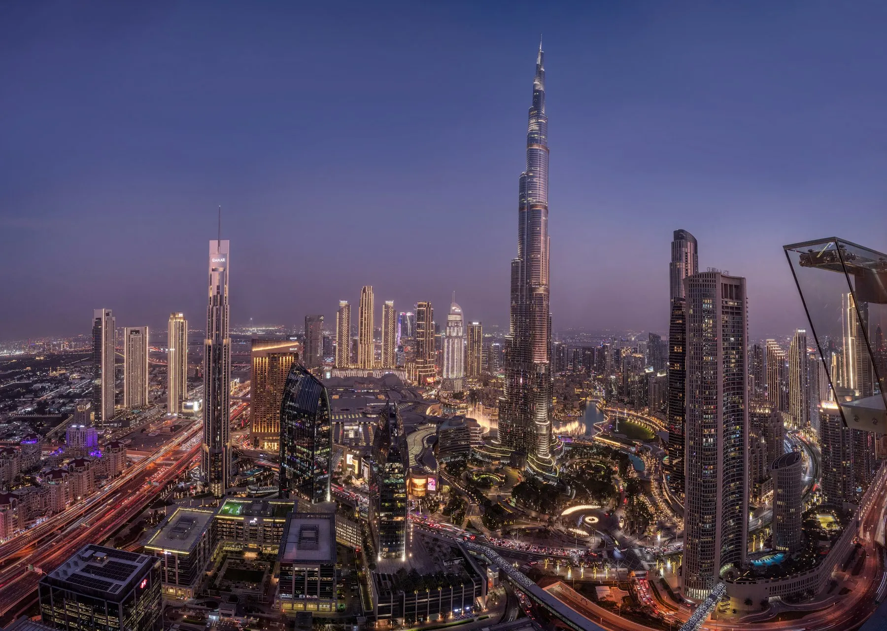 The Burj Khalifa and Downtown Dubai skyline lit up at twilight
