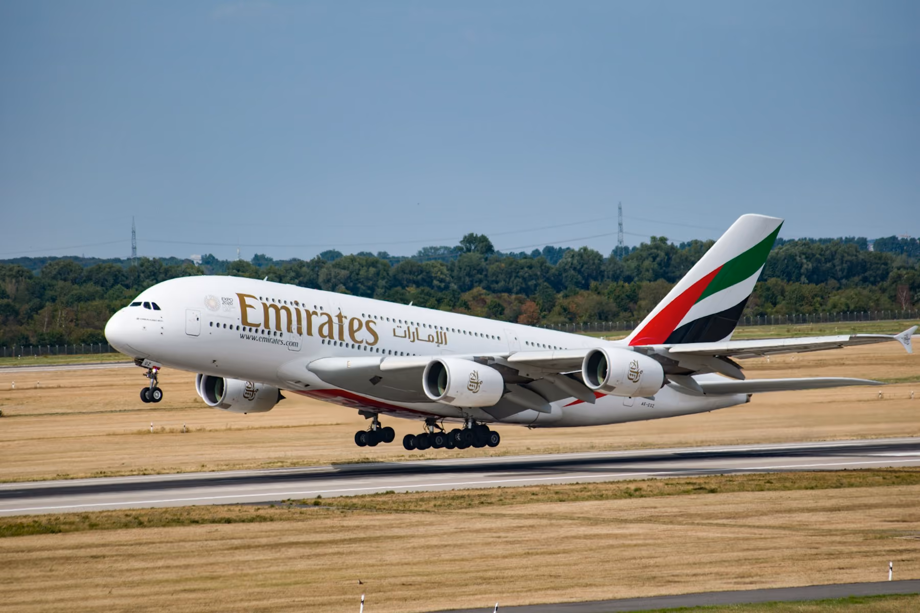 An Emirates A380 lifting off a runway