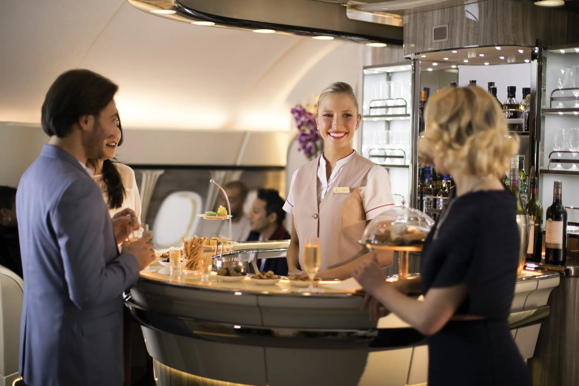 Passengers and crew at the Onboard Lounge bar on the A380