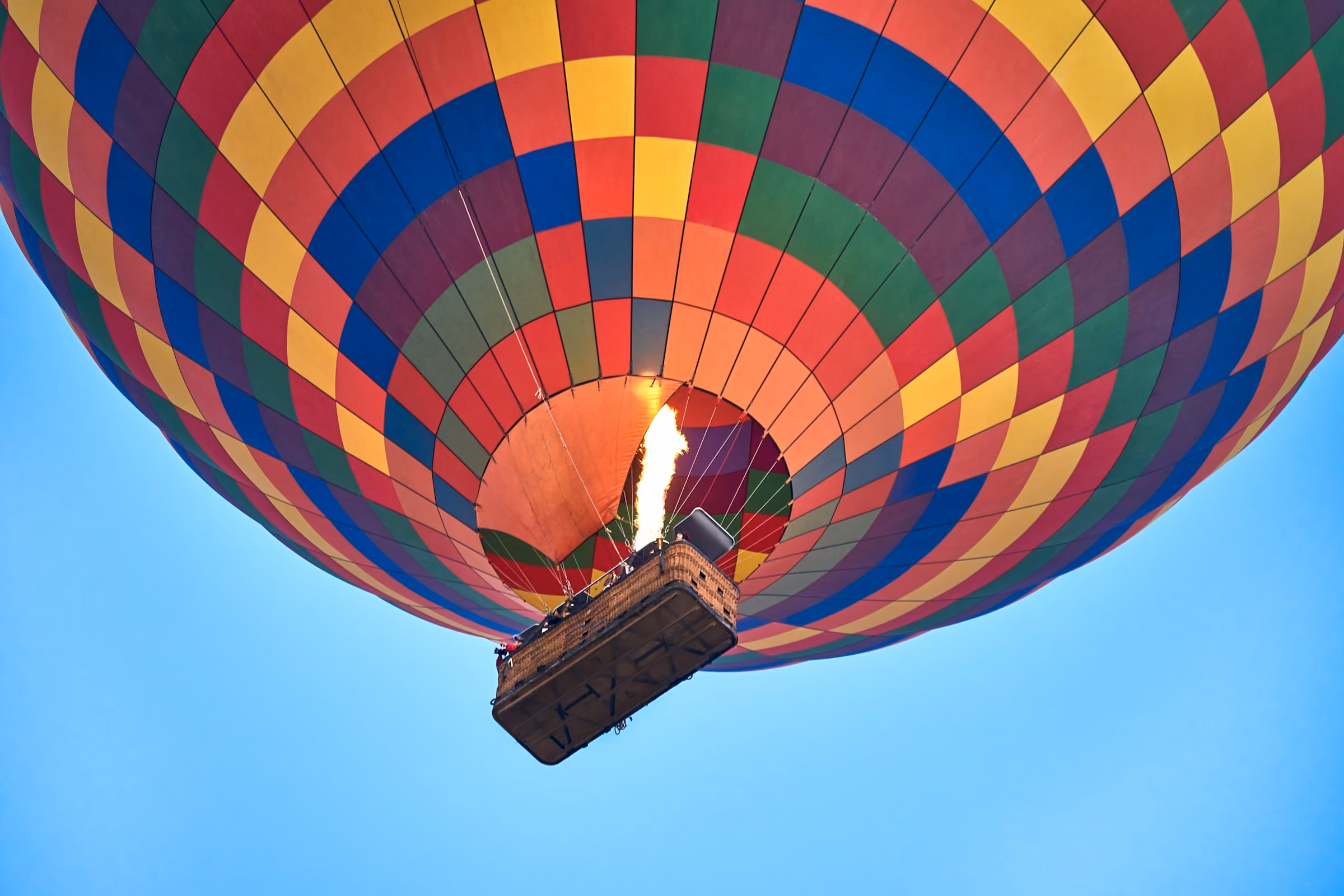 A colourful hot air balloon overhead