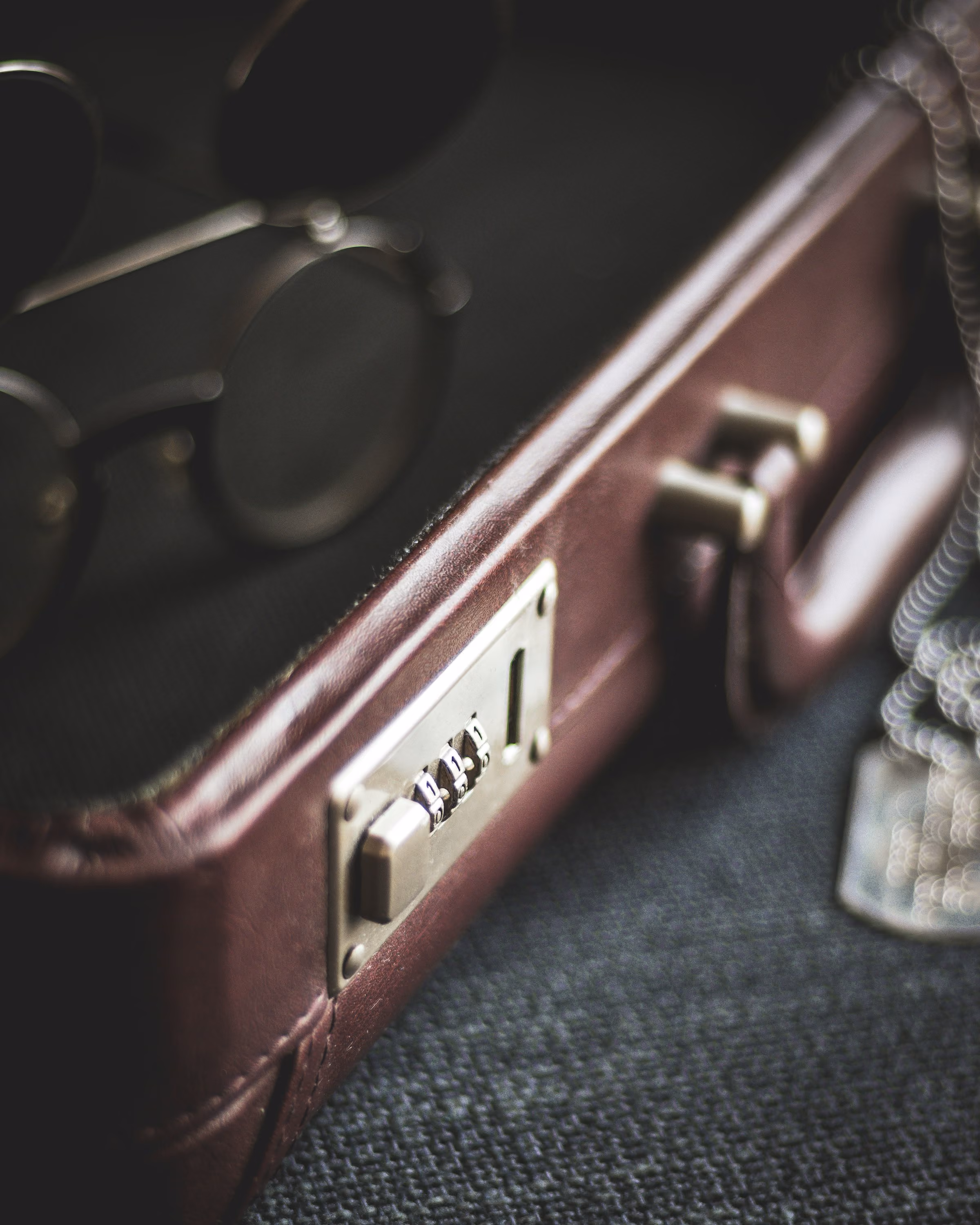 The brass lock of a leather briefcase, close up