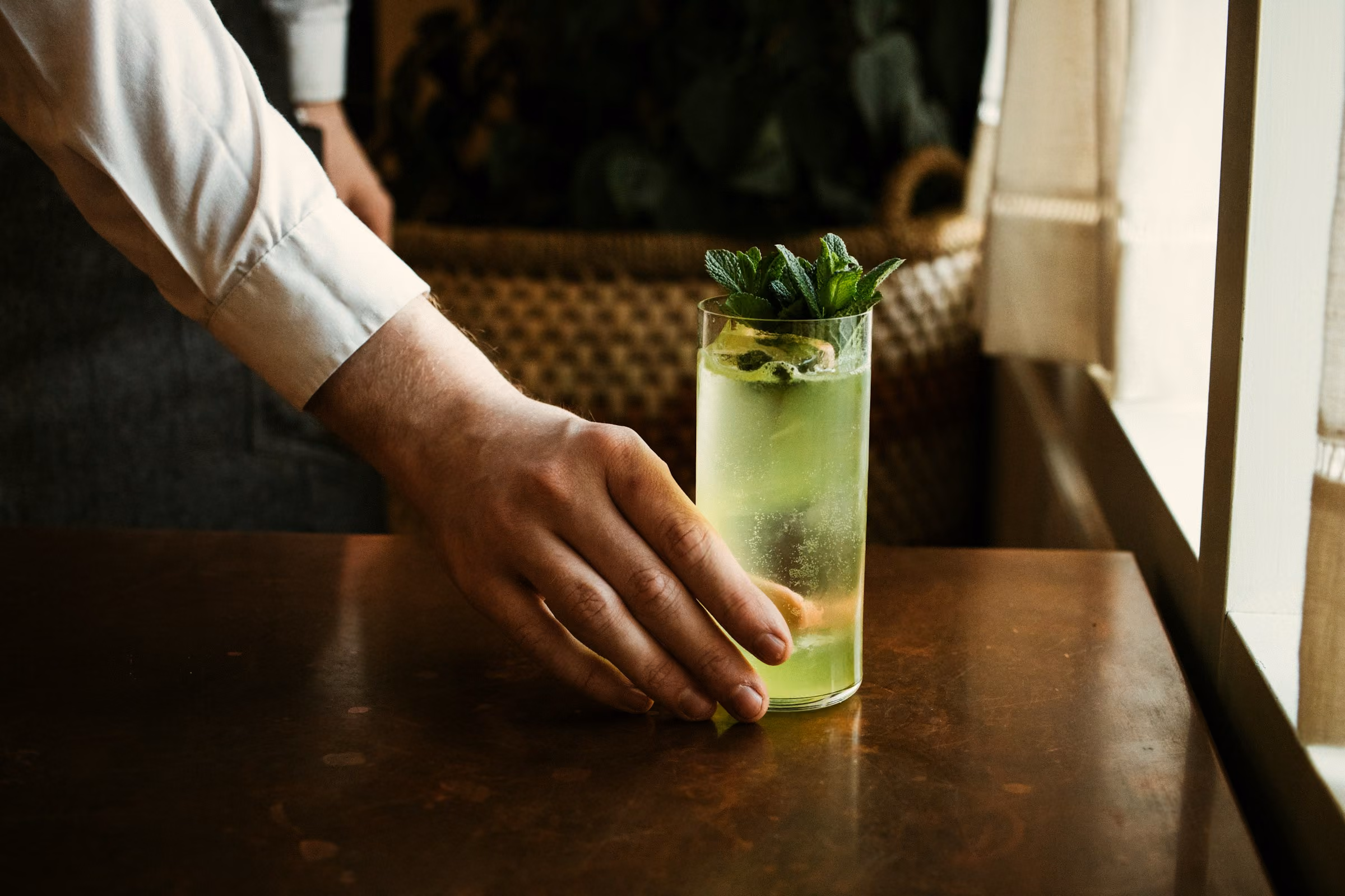 A cocktail placed on a bar table