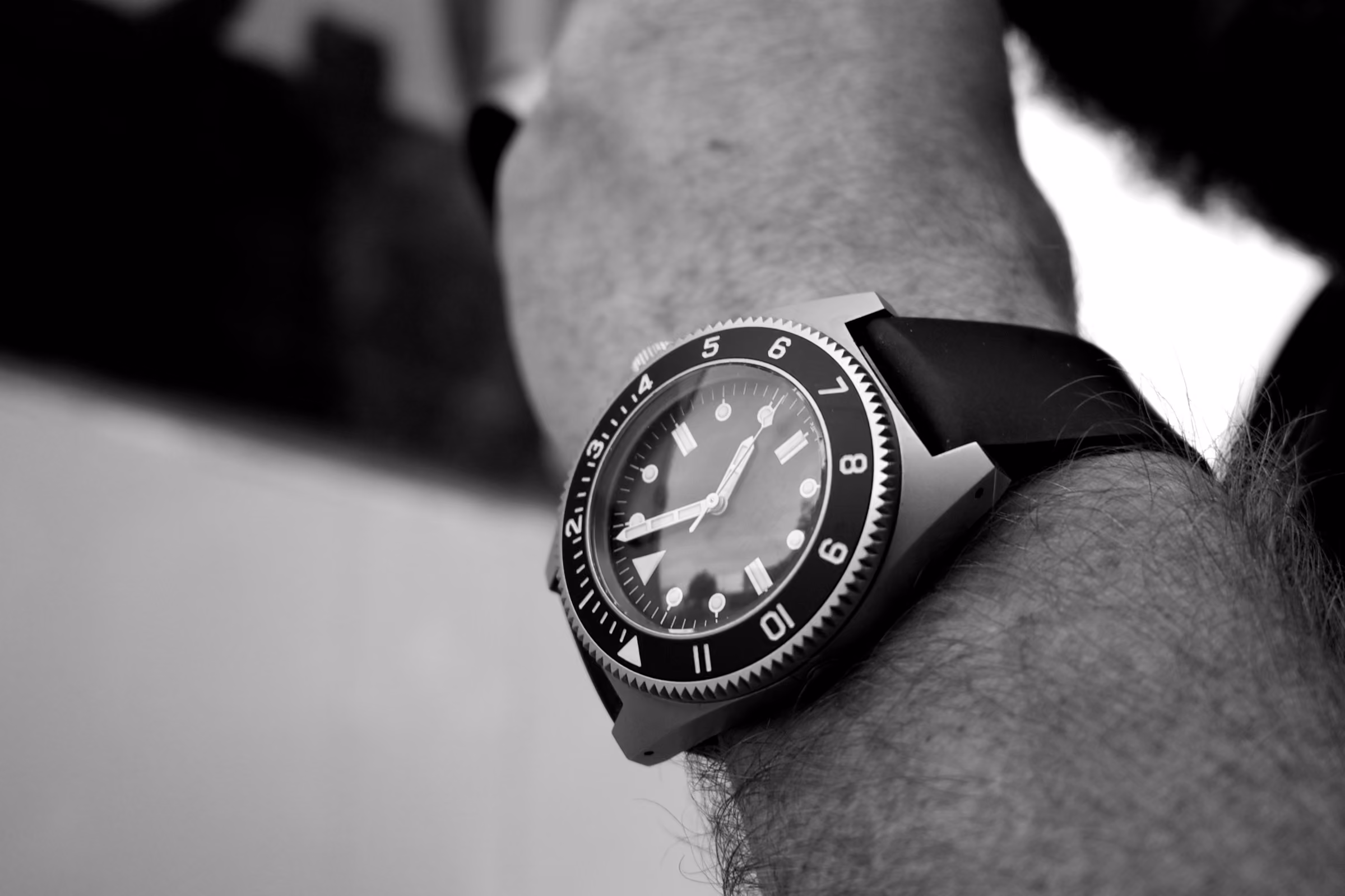 A dive watch on a rubber strap
