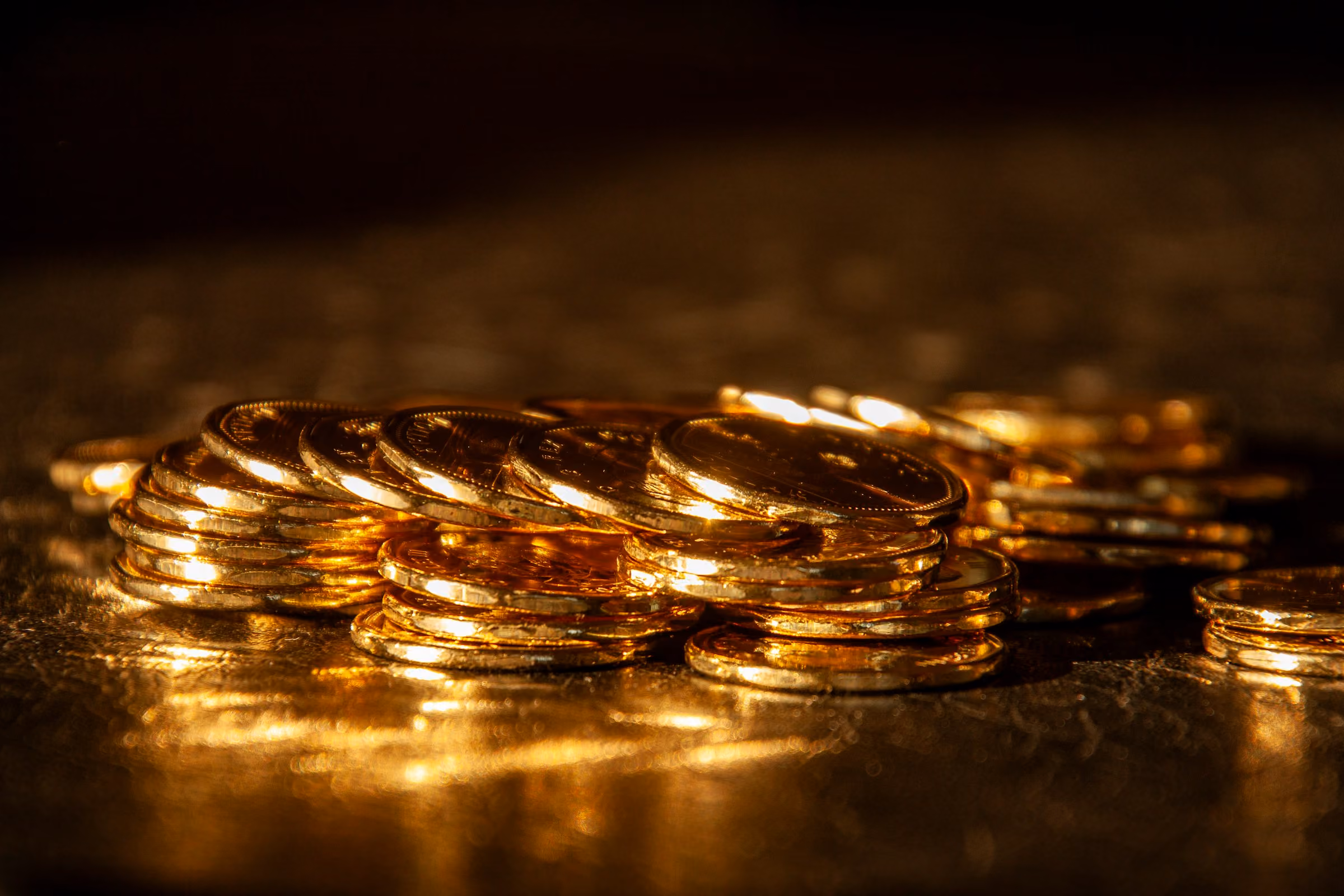Gold coins glowing in low light