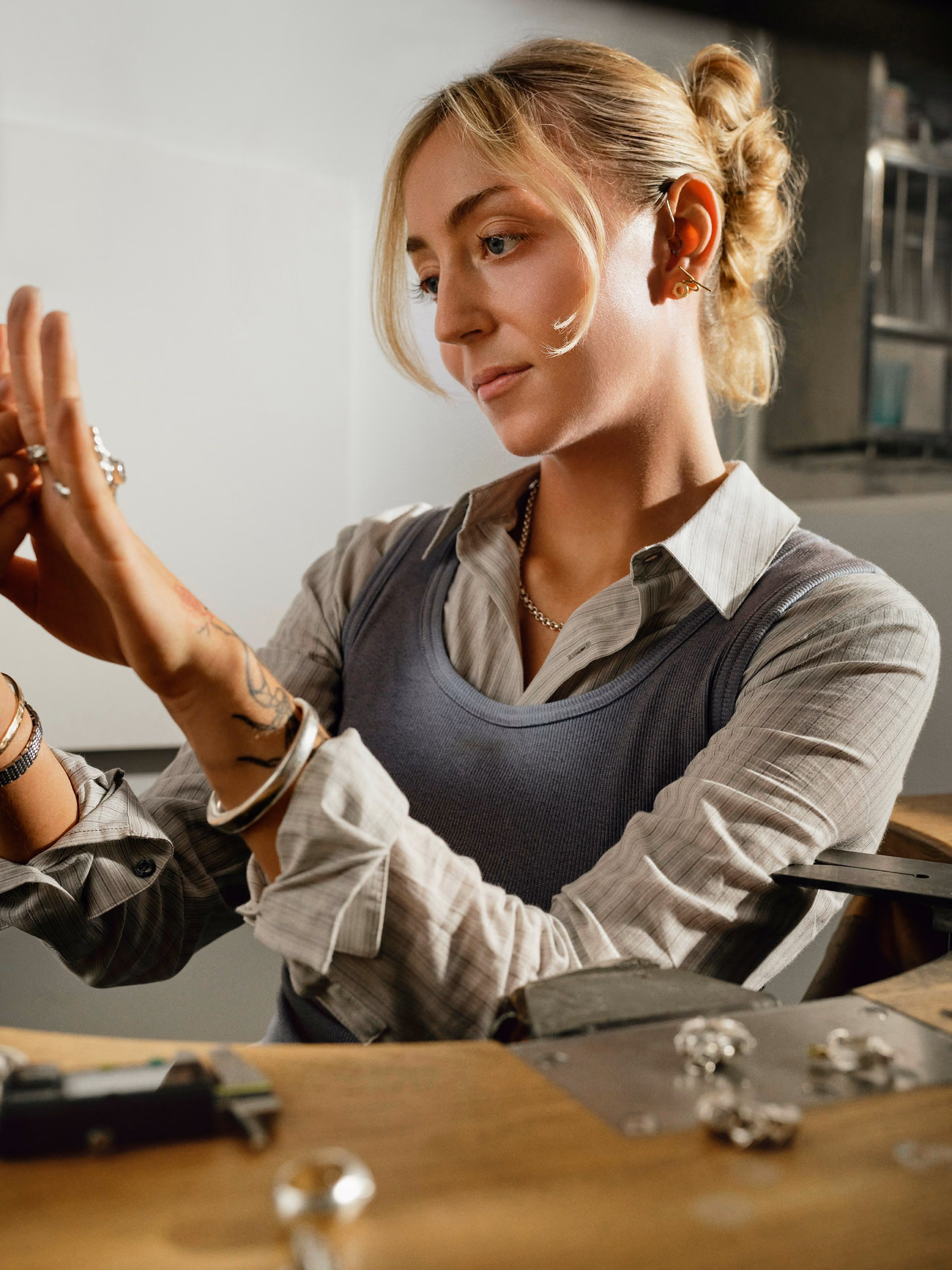 A jeweller checking a ring at the bench