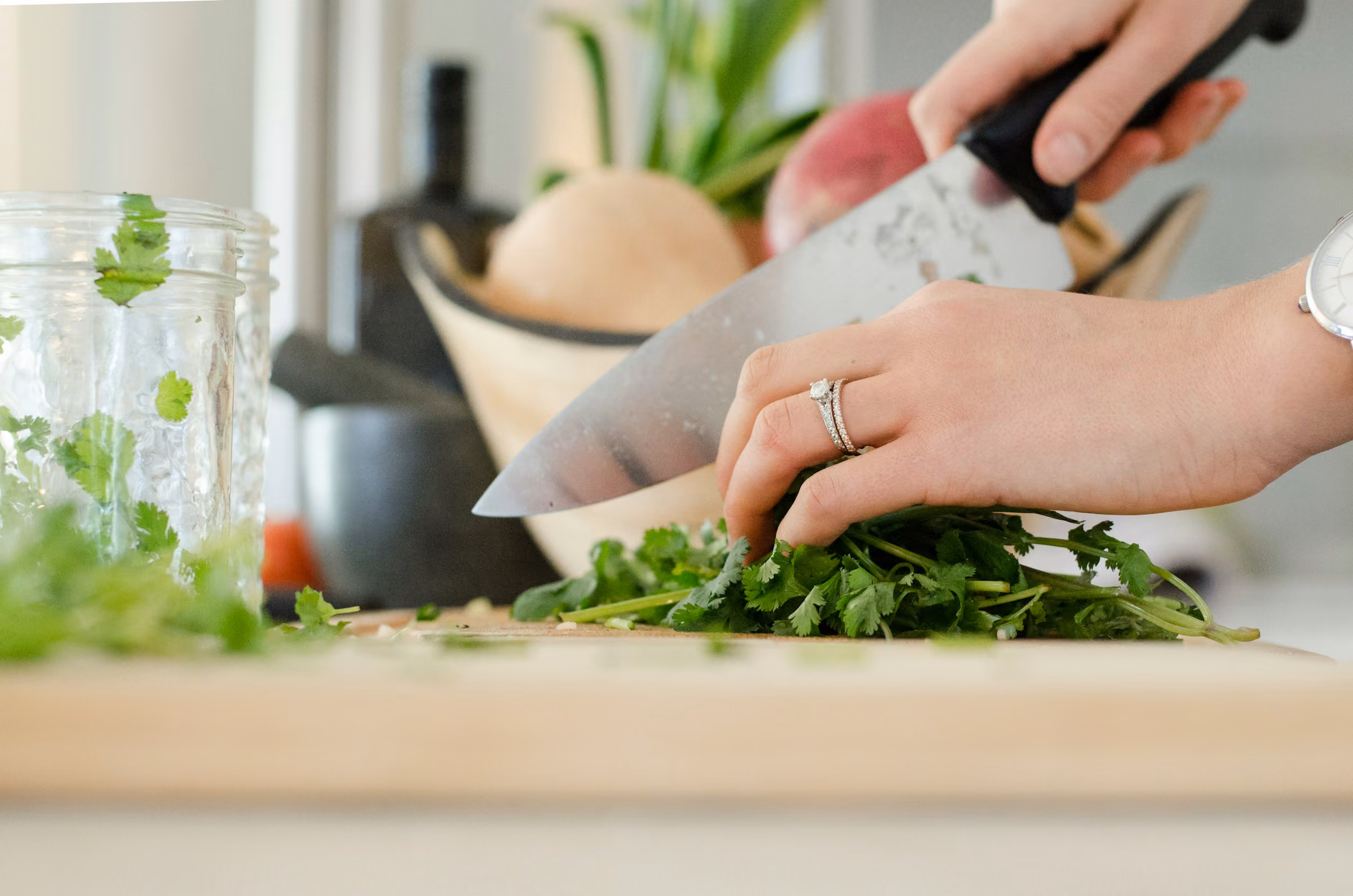 Chopping herbs with a chef's knife
