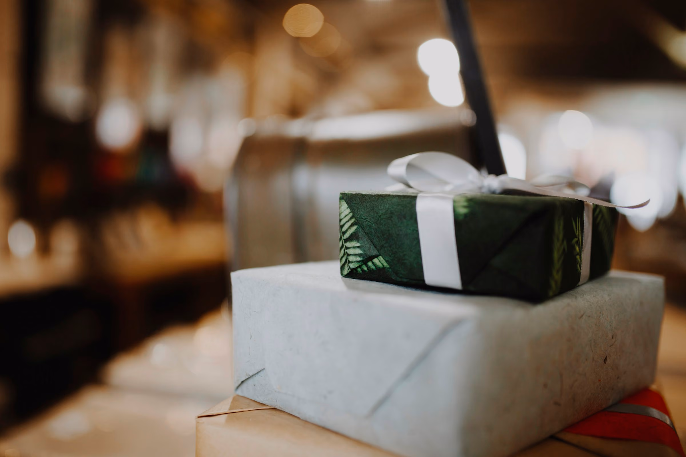 30th birthday gift ideas: a wrapped present on a table in warm light