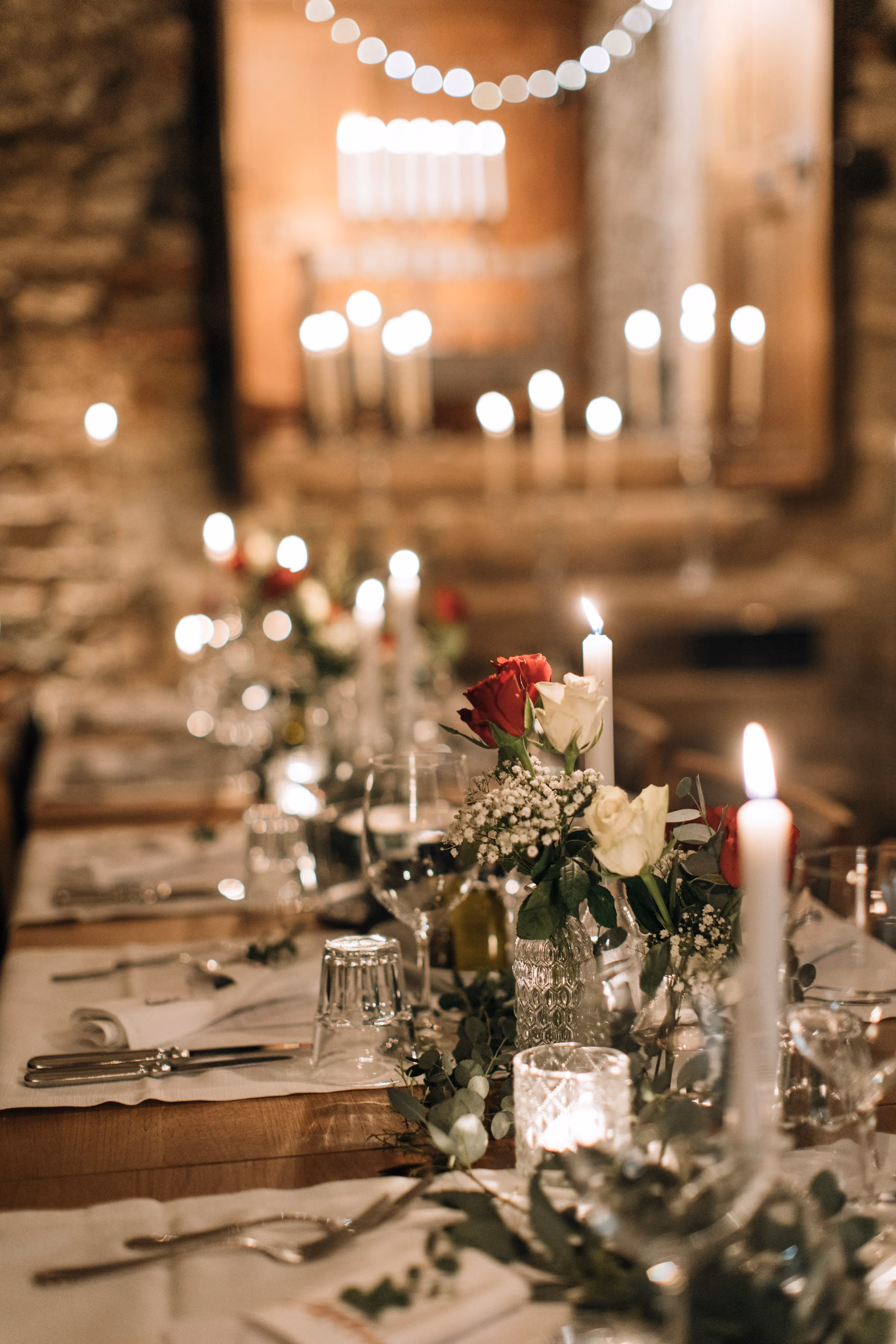 Candles and roses on a dinner table
