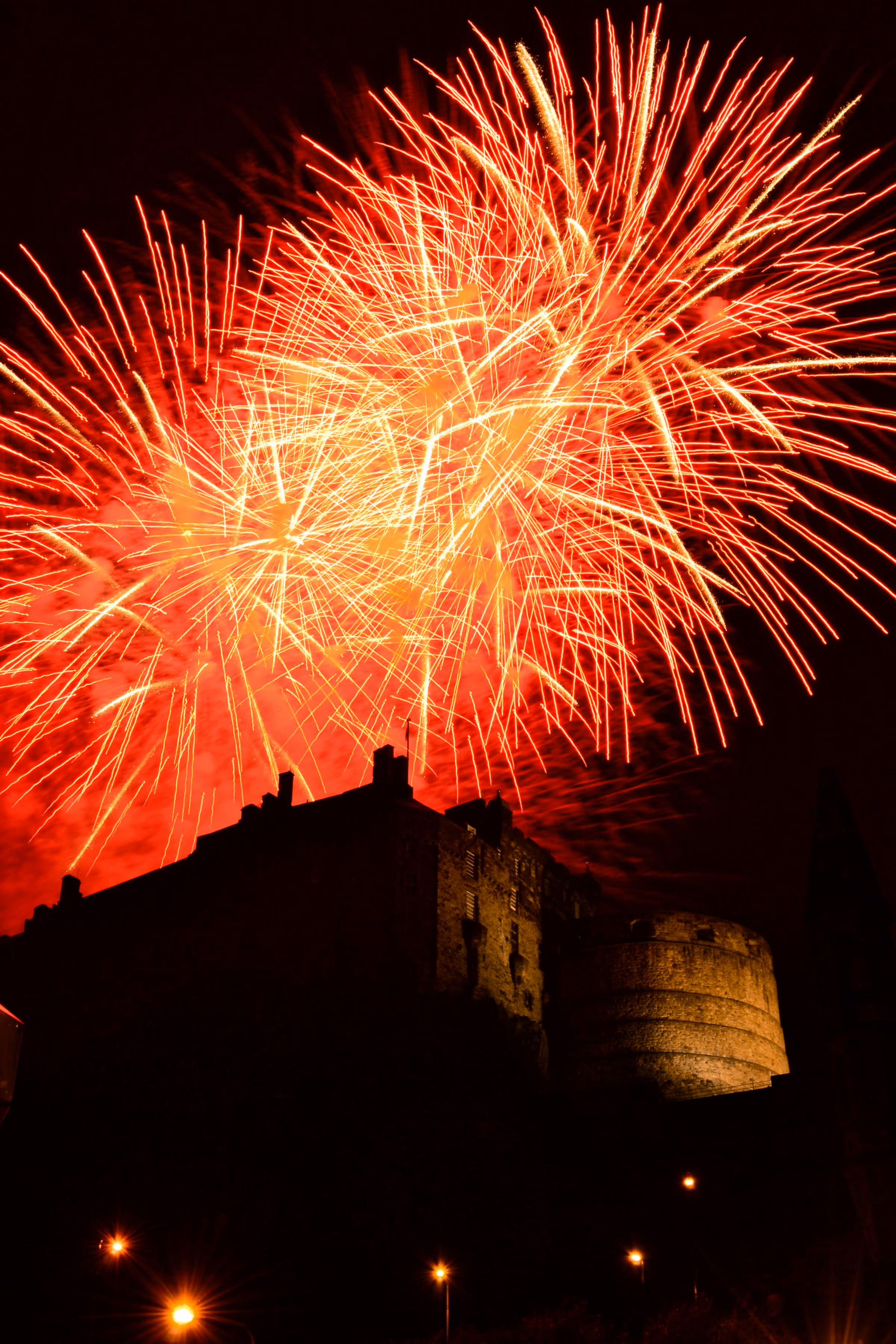 Hogmanay Edinburgh: fireworks bursting over Edinburgh Castle at midnight