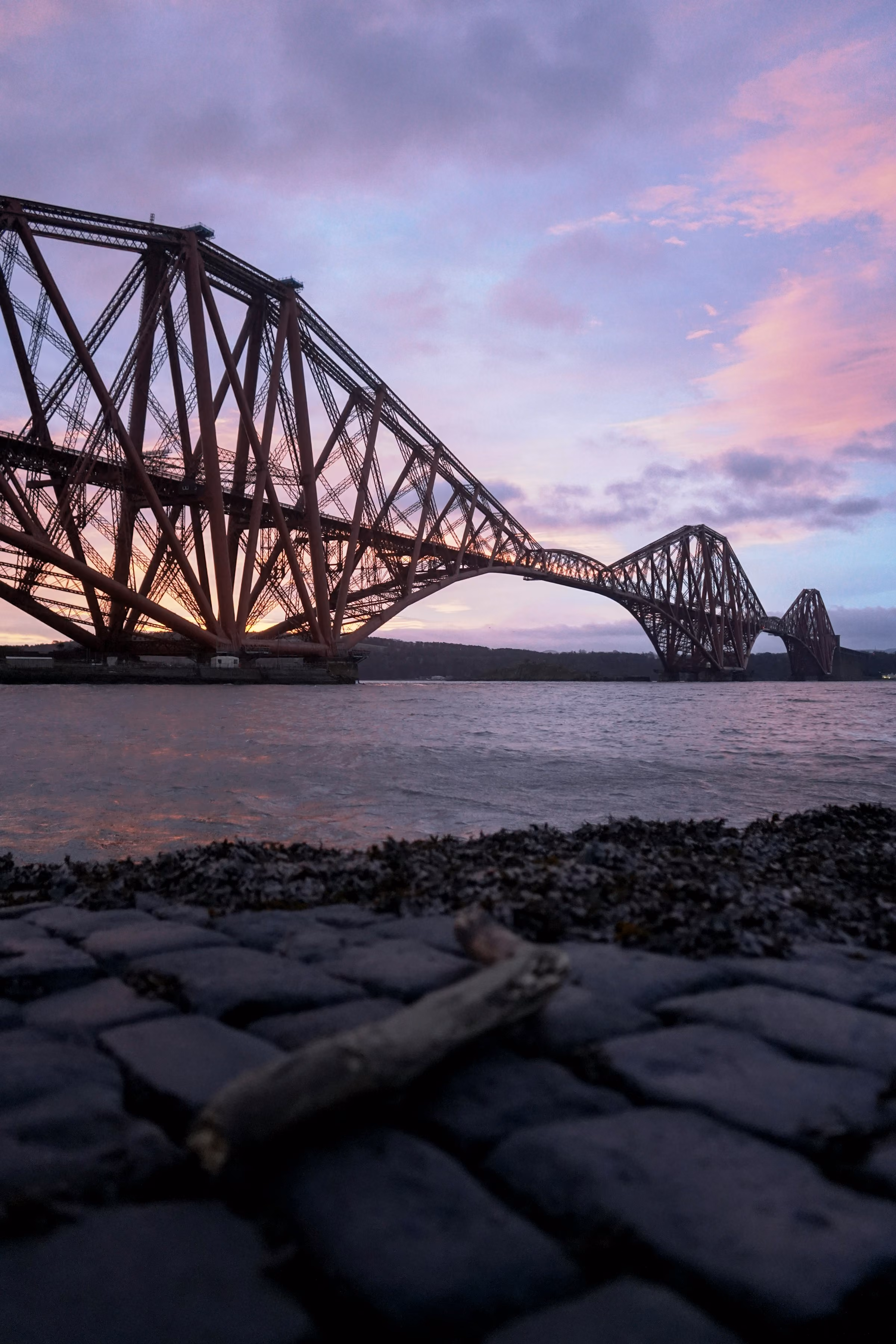 The Forth Bridge at dusk from the shore