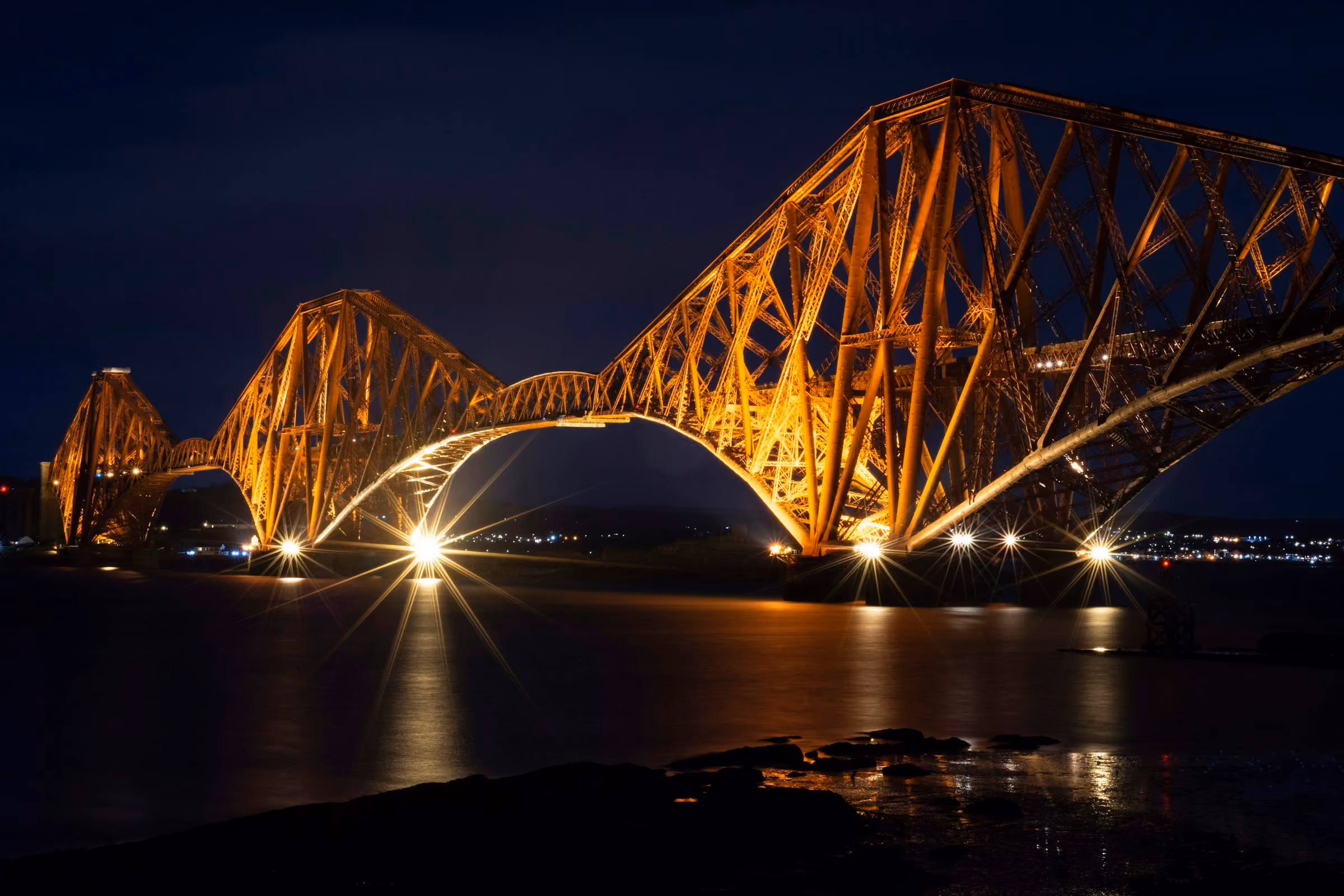 The Forth Bridge lit at night
