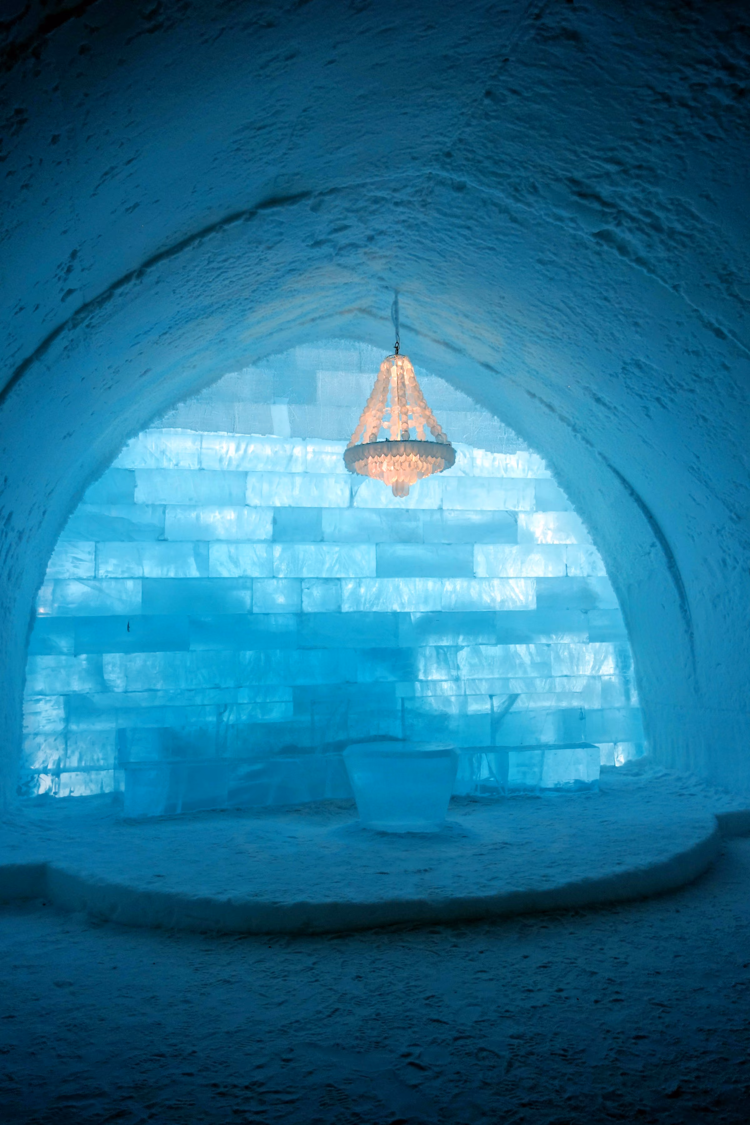 A blue hall carved from ice with an ice chandelier, in Swedish Lapland