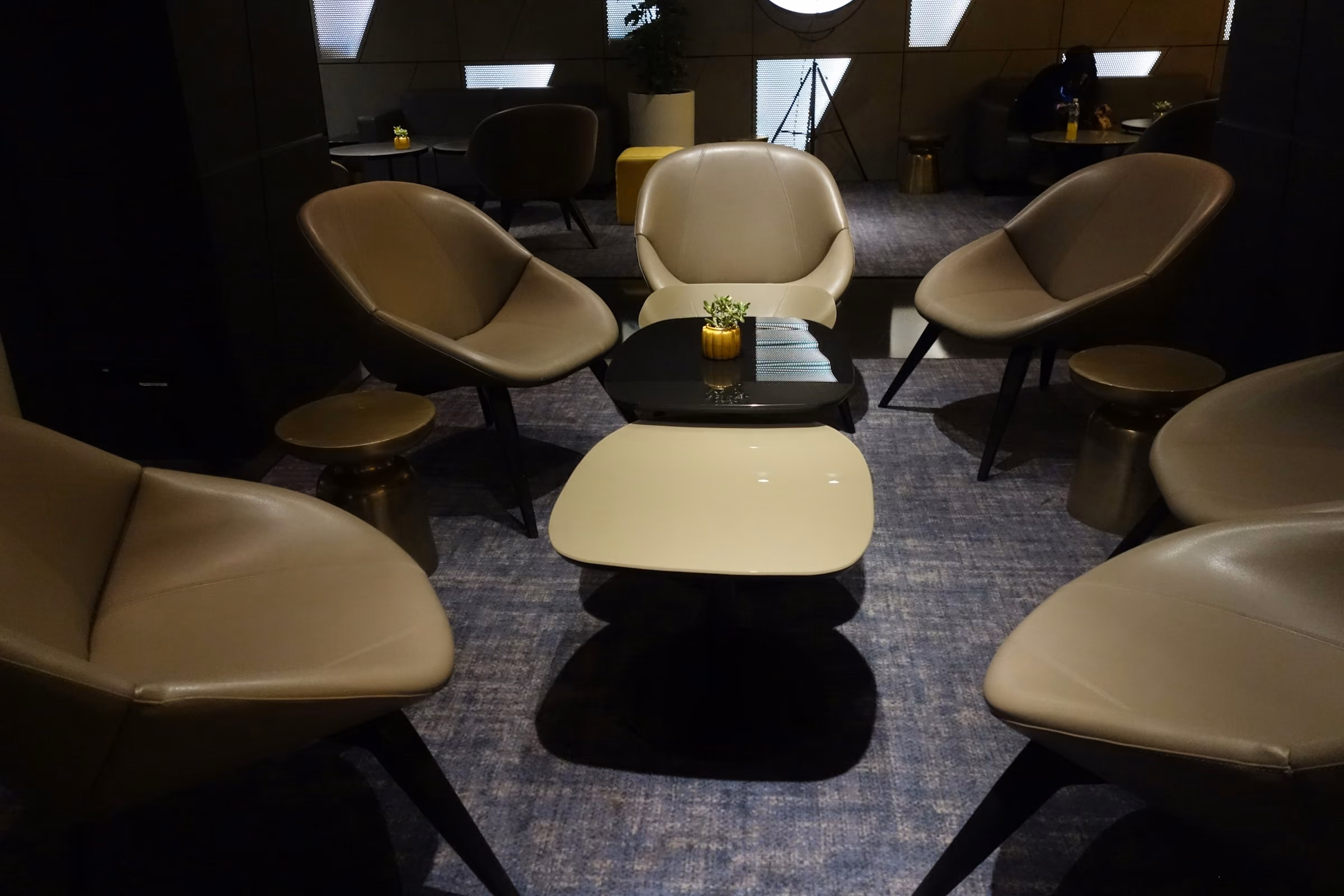 Cream armchairs and low tables in a calm lounge