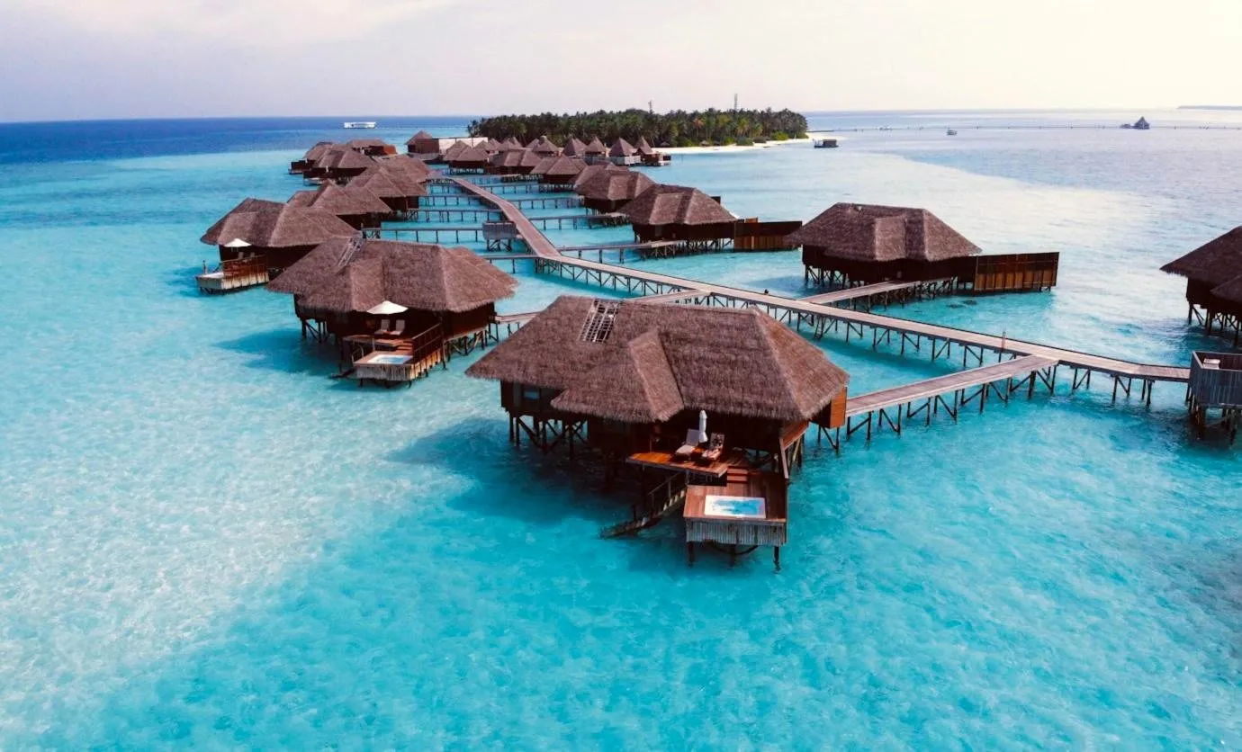 Overwater villas on a turquoise lagoon in the Maldives