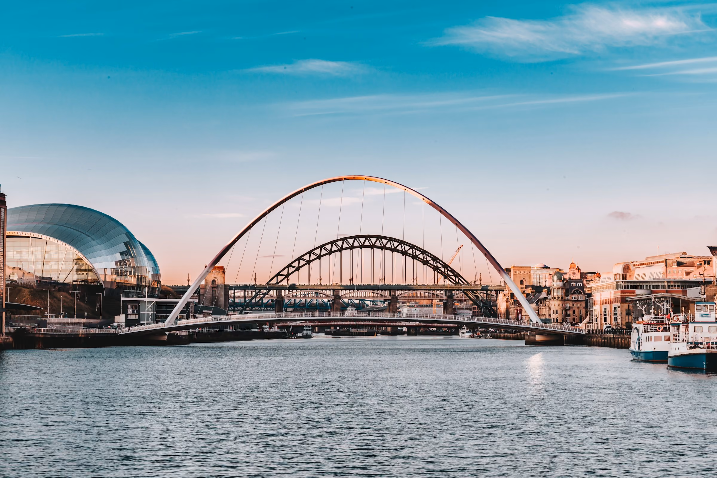The Gateshead Millennium Bridge and the Tyne at dusk