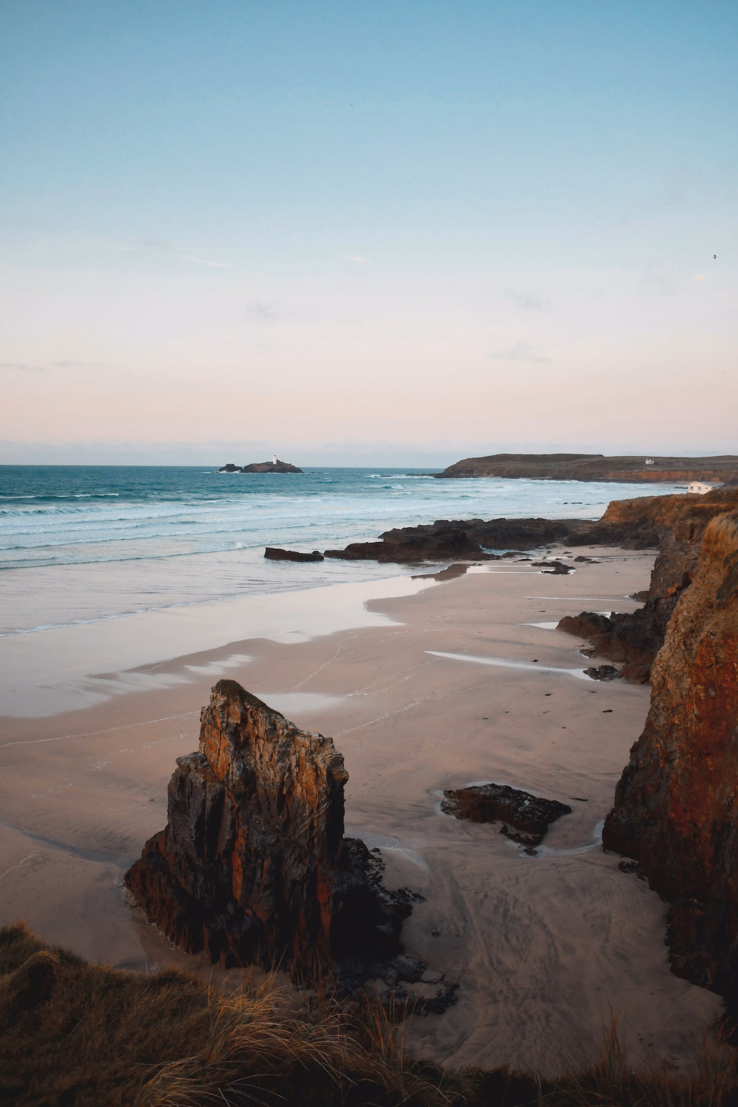 A rock stack on a Cornish beach at low tide