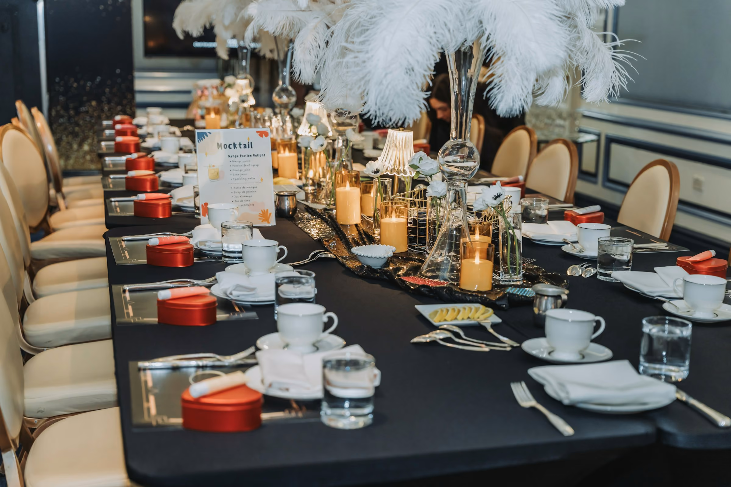 Feather centrepieces down a long gala table