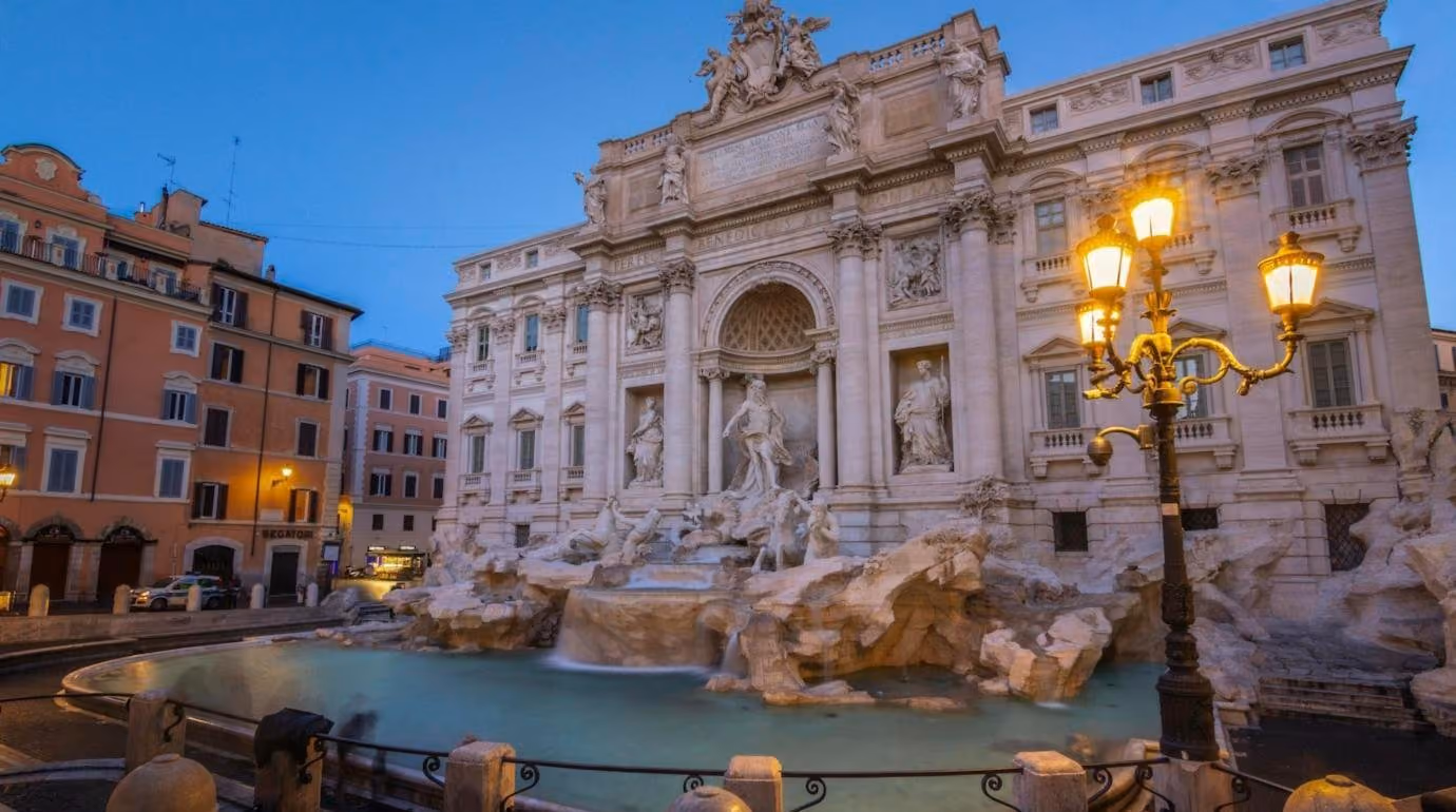 The Trevi Fountain under its lamps after dark