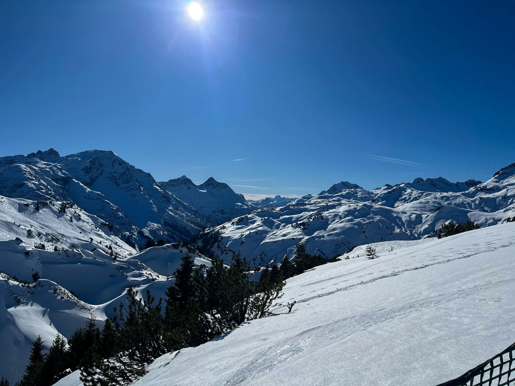 Snow-covered peaks seen from the slopes at Oberlech