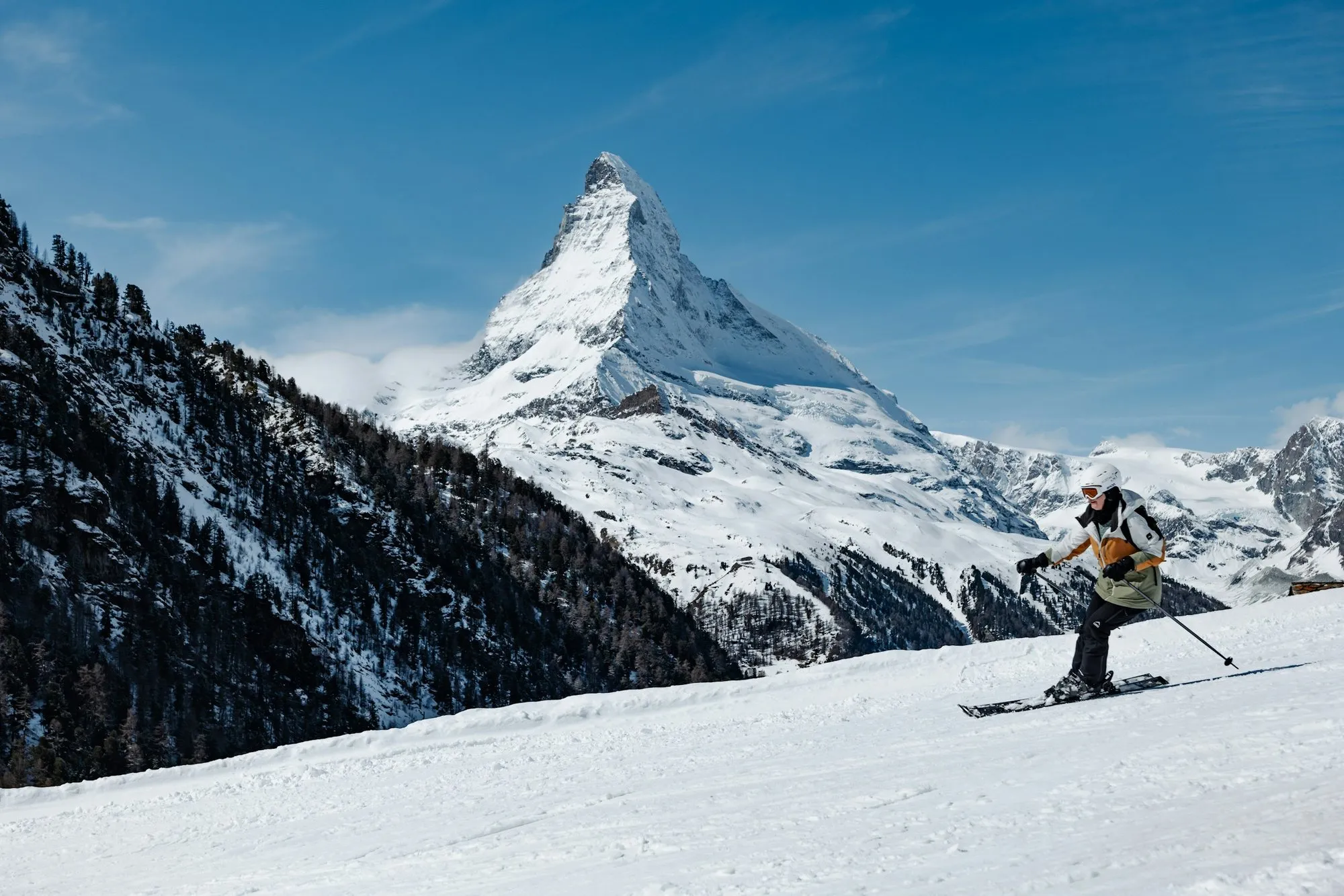 A skier in front of the Matterhorn above Zermatt