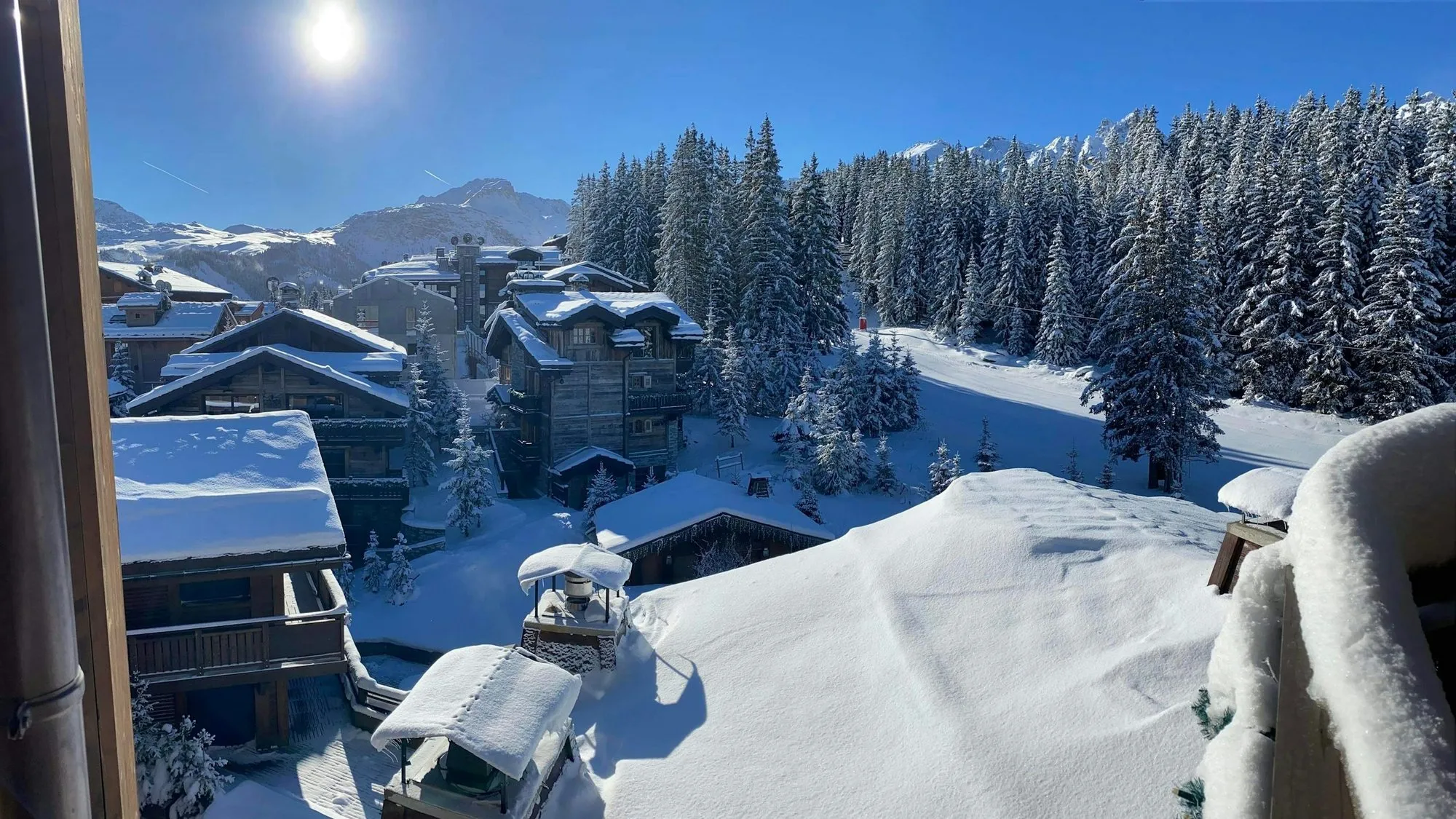 Chalets under deep snow in Courchevel