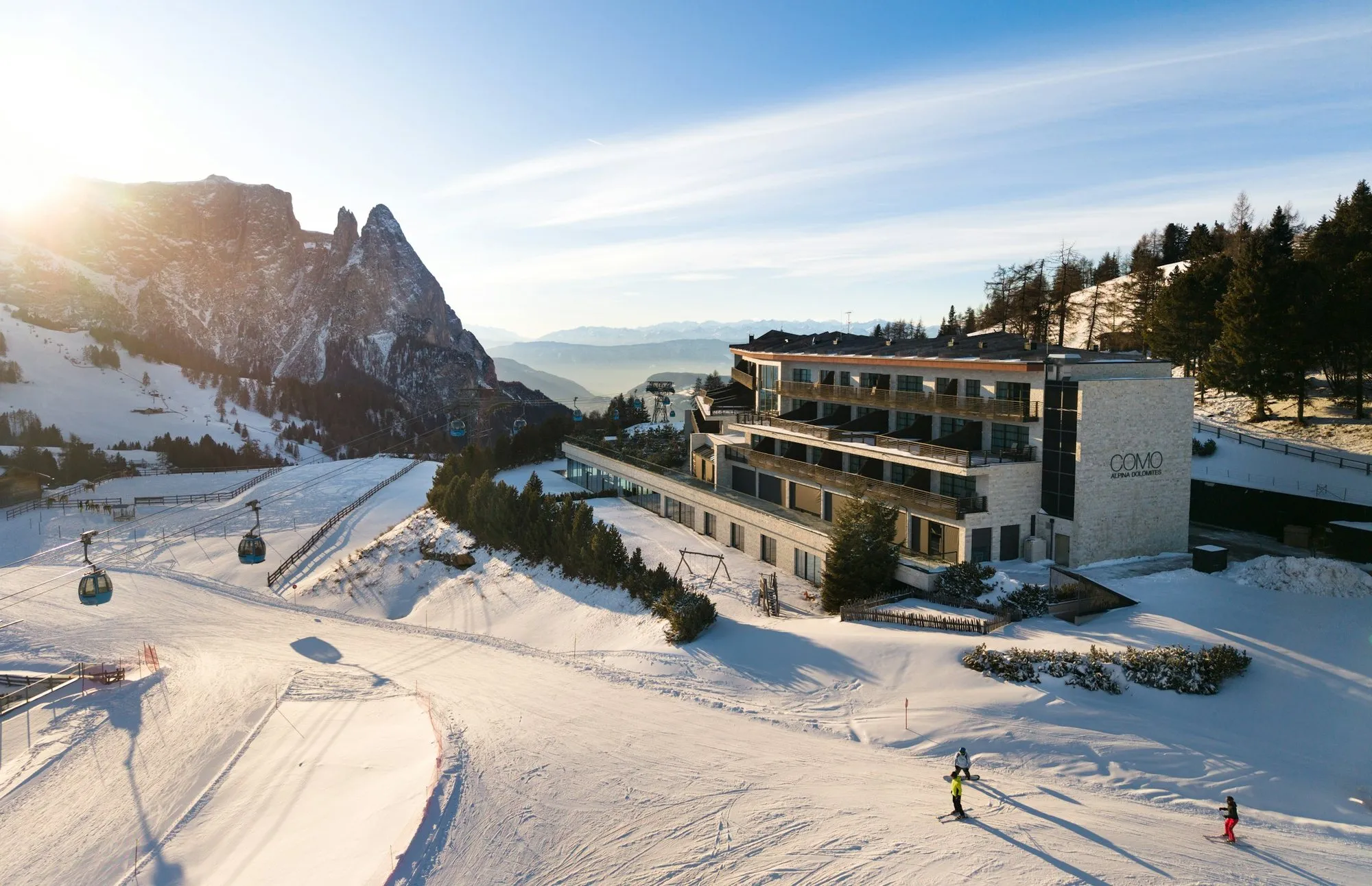 COMO Alpina Dolomites above the ski slopes of the Alpe di Siusi, with the Sciliar behind