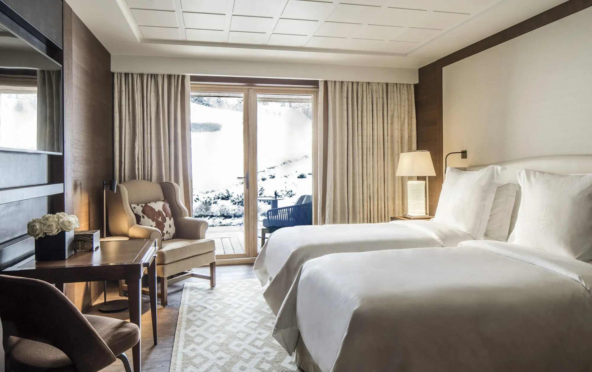 A guest room at Four Seasons Megève with a balcony onto the snow