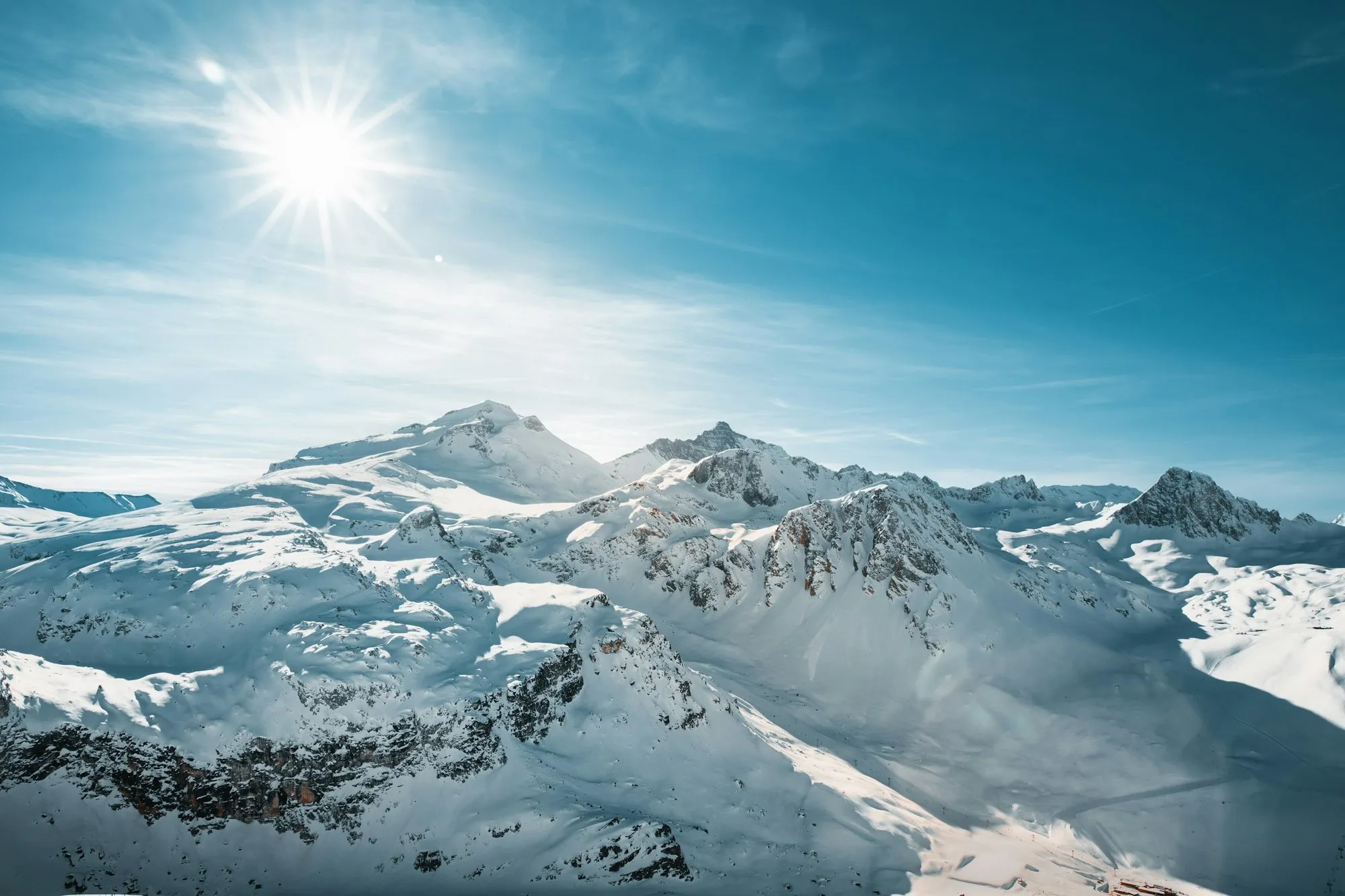 Sunlit snowy peaks above Val d'Isère