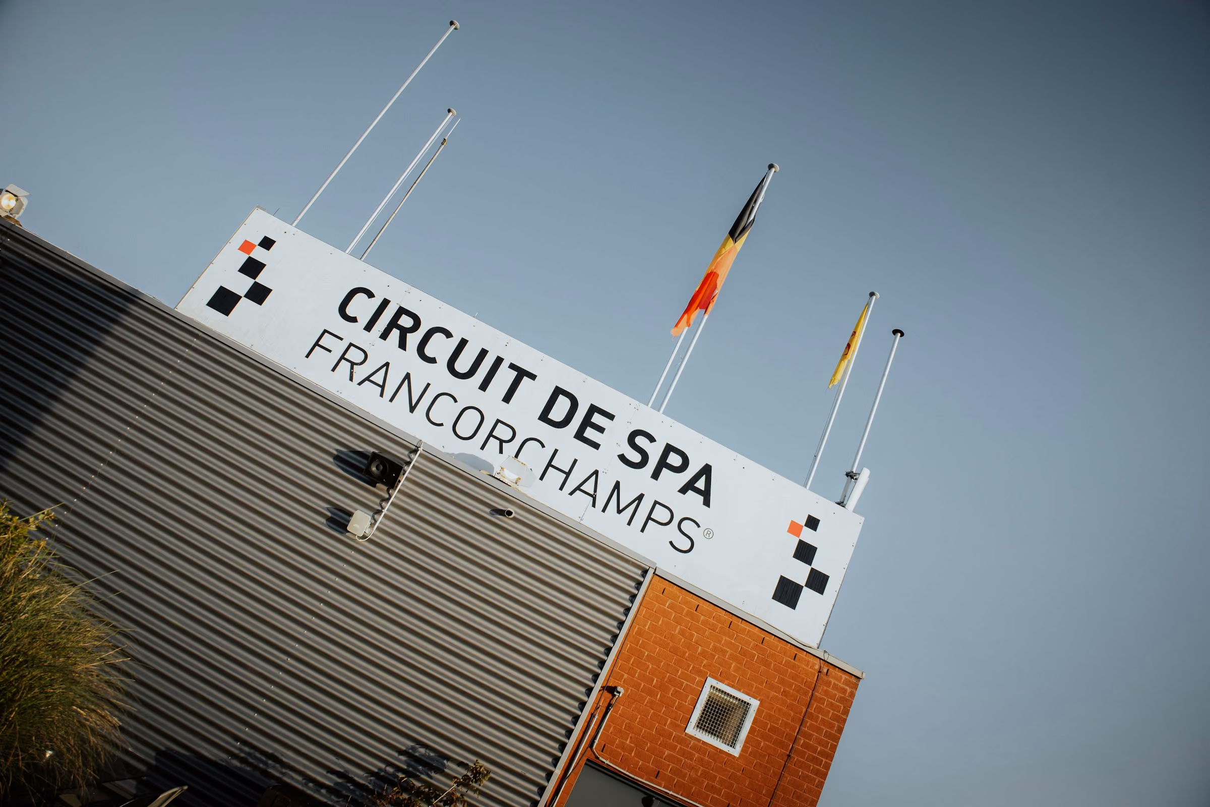 The Circuit de Spa-Francorchamps sign against a blue sky