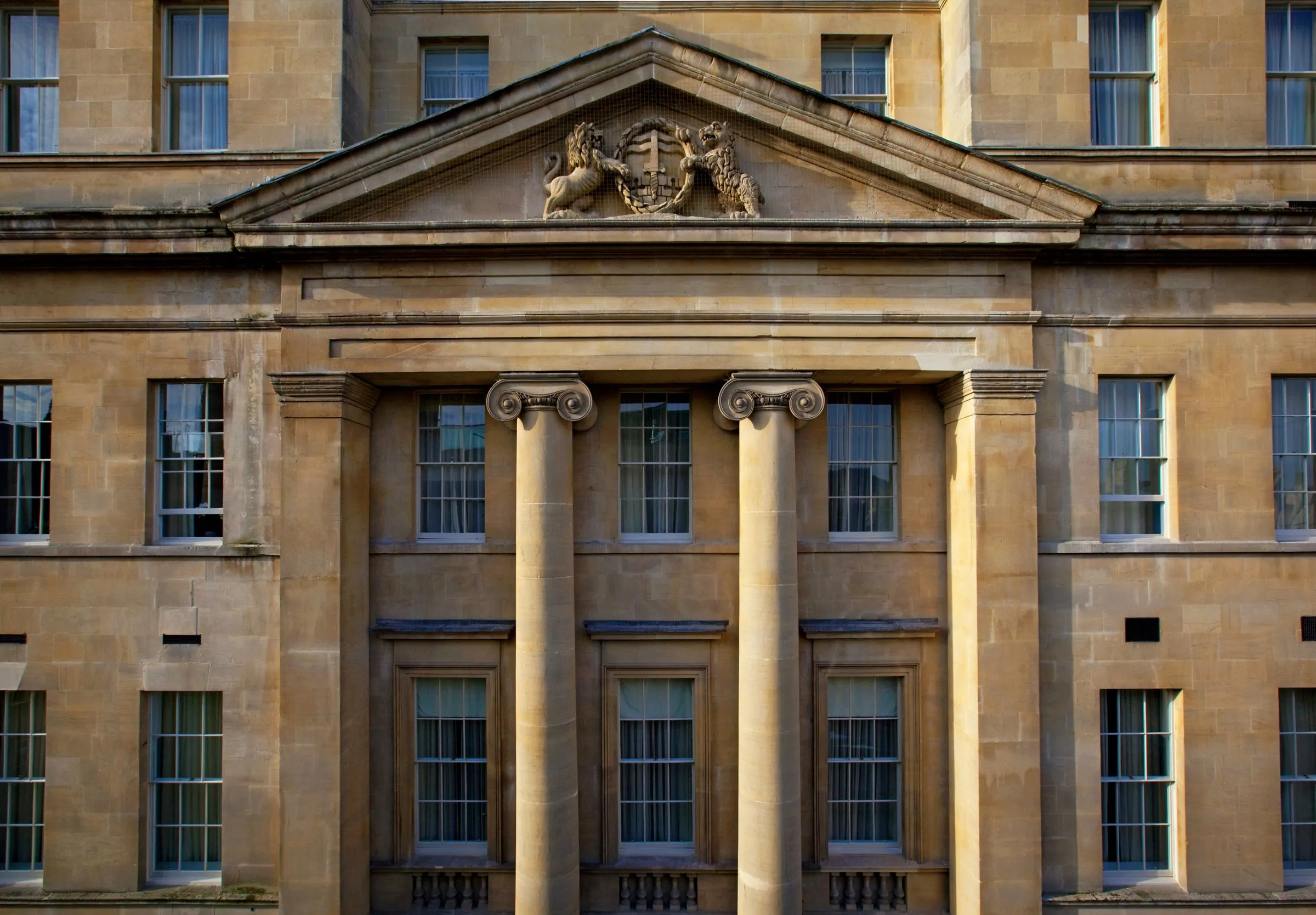 The hotel's honey-coloured Georgian facade with columns