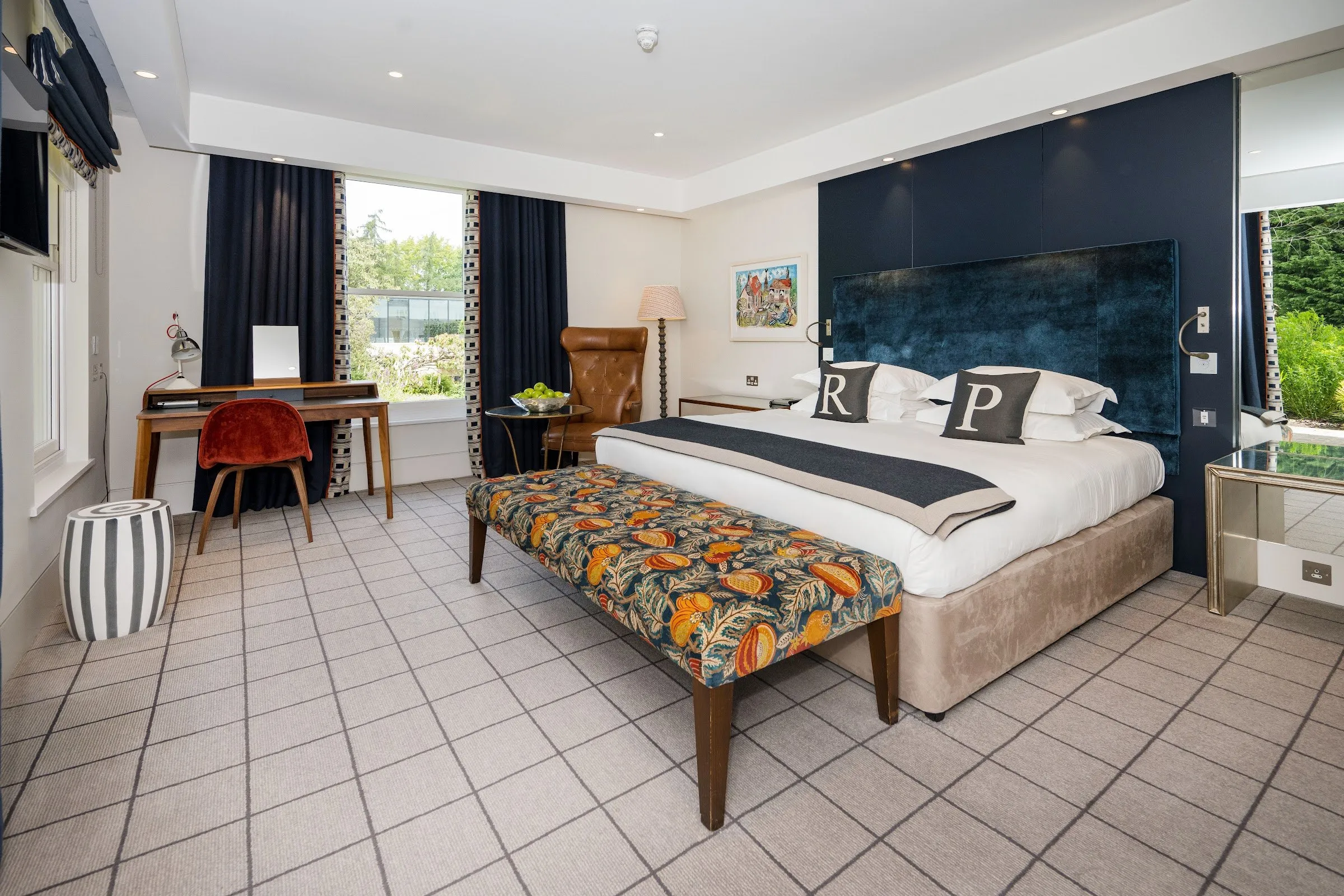 A Rudding Park bedroom with a large bed and a garden view