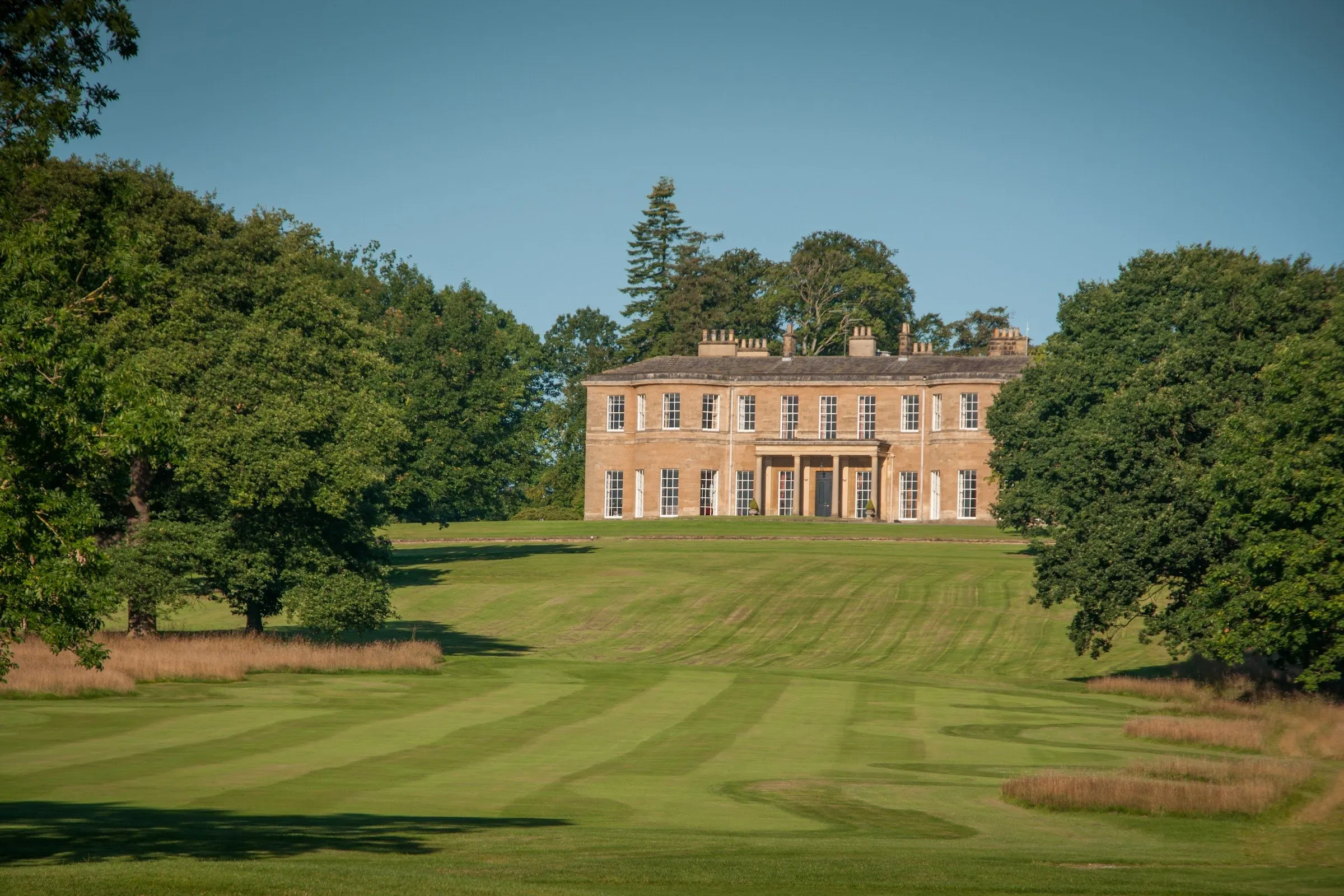 The house at Rudding Park across a sweep of lawn