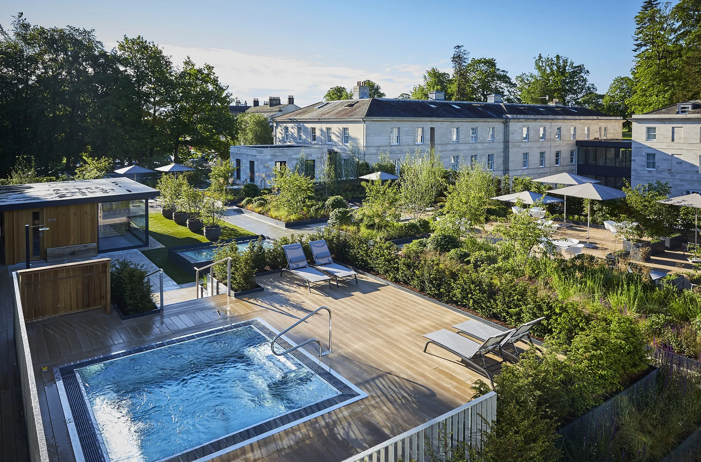 The Roof Top Spa's hydrotherapy pool seen from above, among the gardens