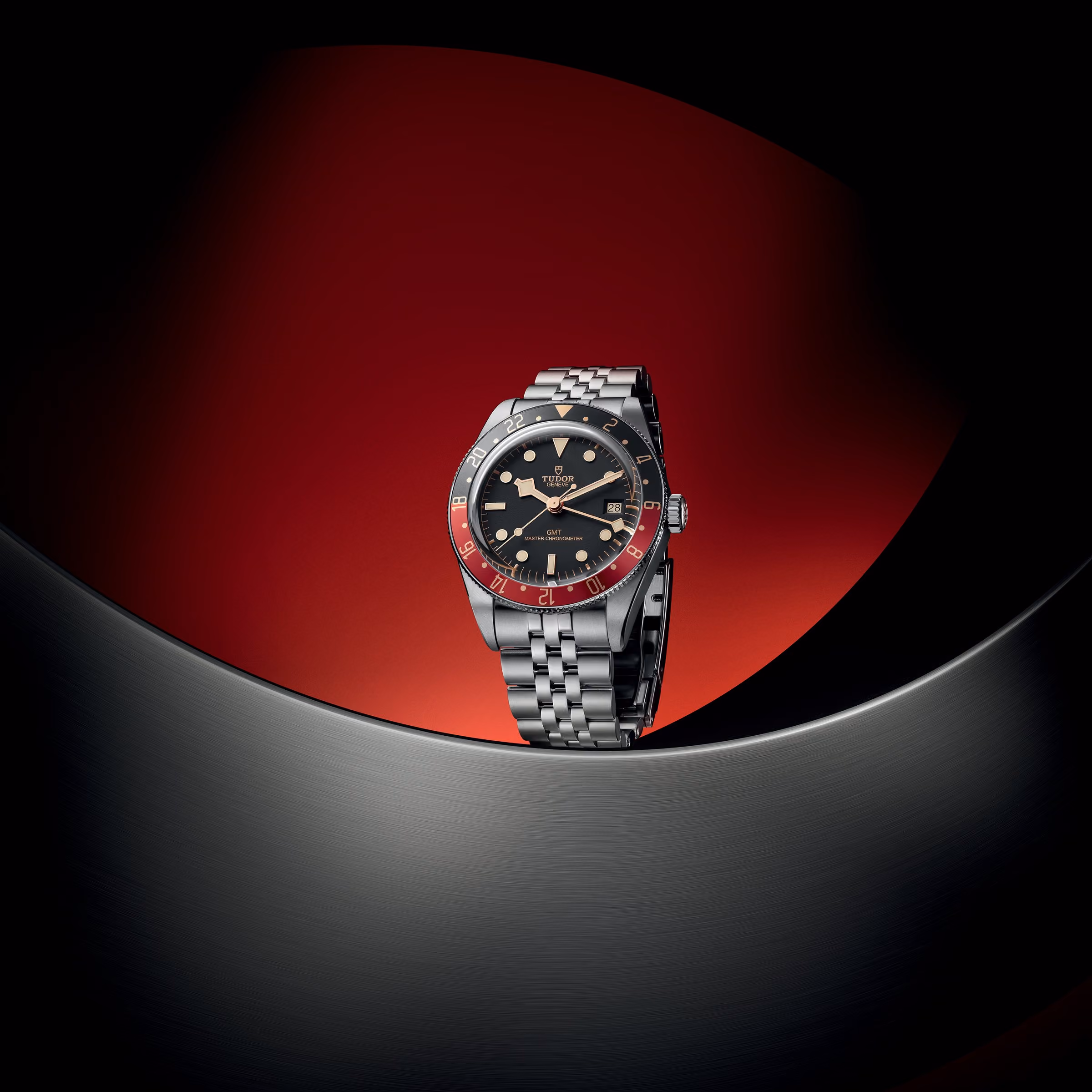 A GMT watch for travel: the Tudor Black Bay 58 GMT on a red and black stage