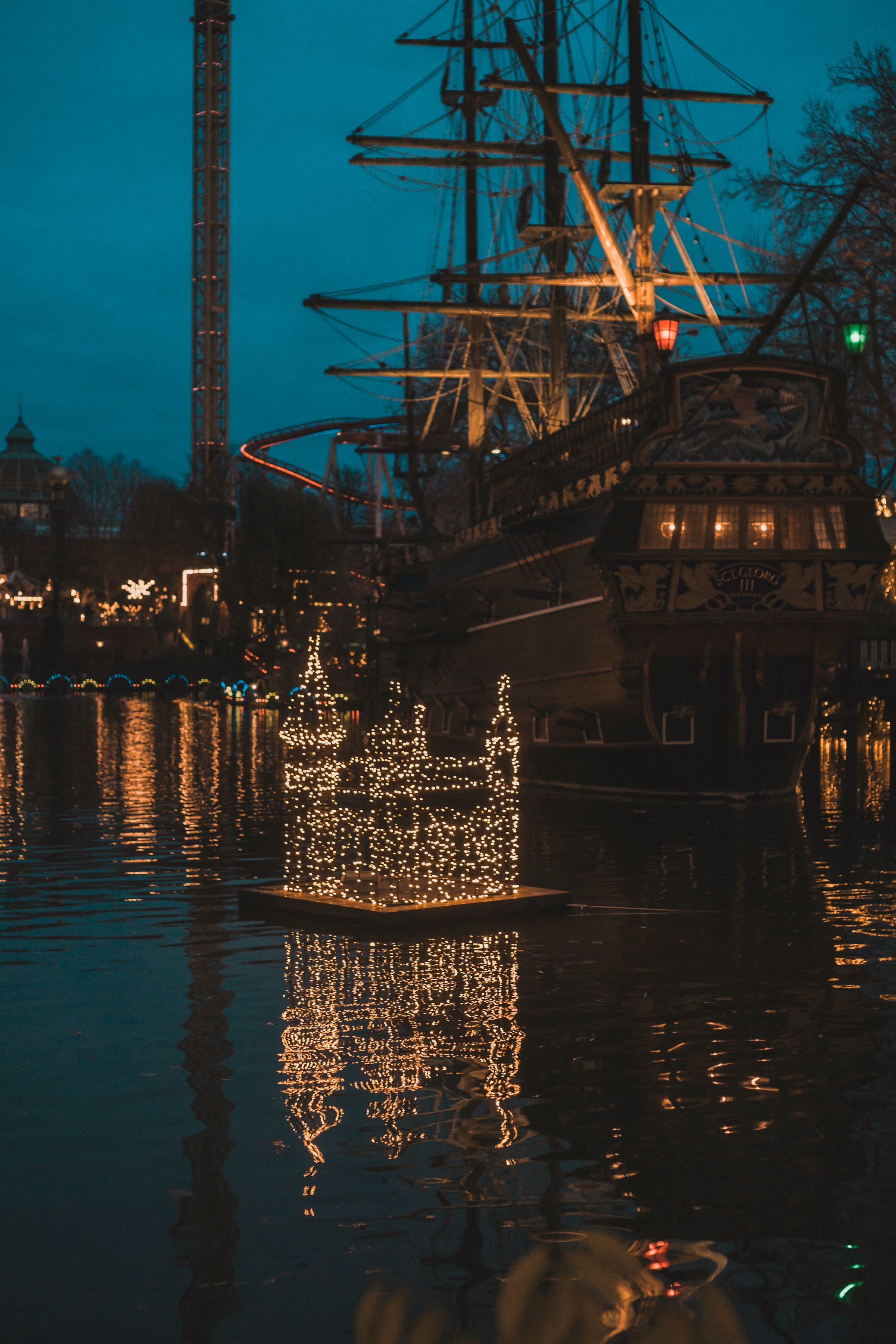 The lake and ship at Tivoli Gardens lit at night